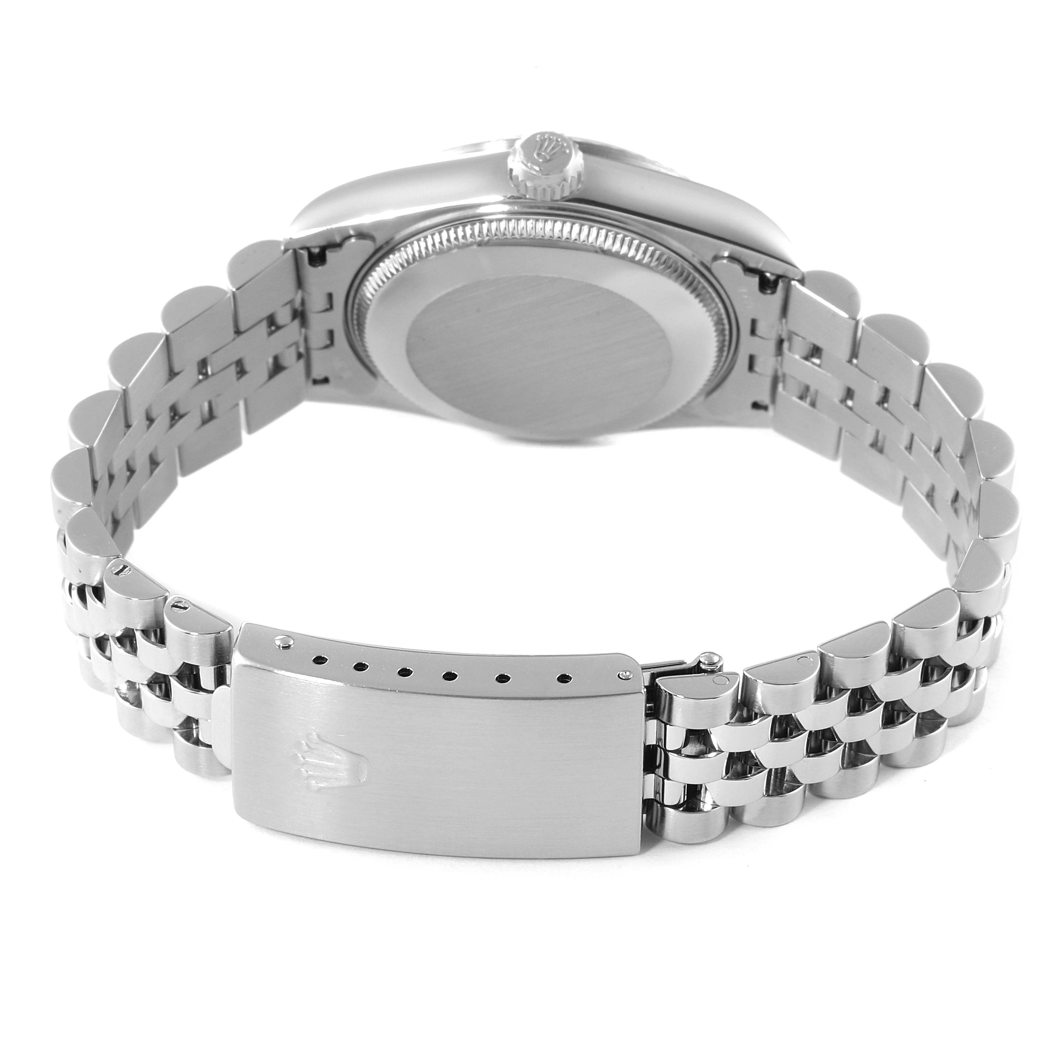 This image shows the back view and bracelet of a Mid-Size Rolex watch, highlighting the clasp and case back.