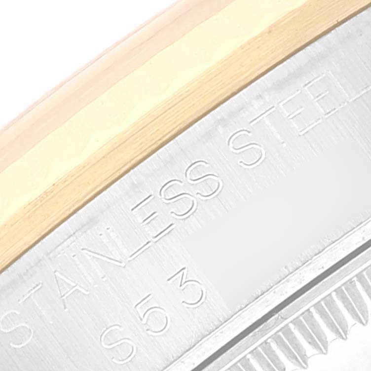 This close-up image shows the stainless steel and gold rim of a Rolex Mid-Size 68273 Women's Steel and Gold (two tone) Champagne Dial 68273 Women's Steel and Gold (two tone) Champagne Dial watch model.