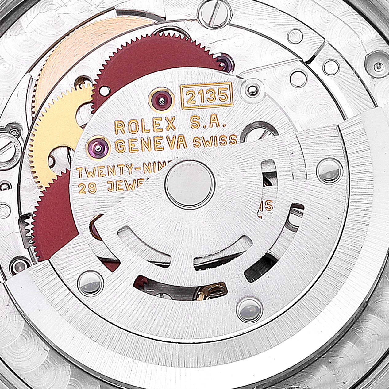 This close-up image shows the intricate inner movement mechanism of a Mid-Size Rolex watch, highlighting the gears and jewels.