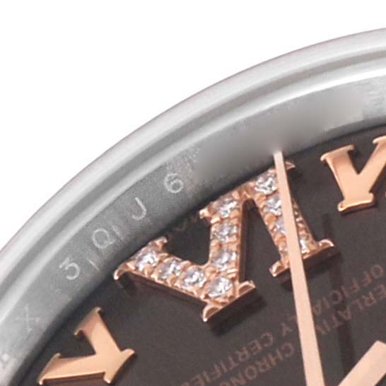 This image shows a close-up top angle of the dial and Roman numeral hour markers on a Rolex Datejust 179171 Women's Steel and Gold (two tone) Brown Dial 179171 Women's Steel and Gold (two tone) Brown Dial watch.
