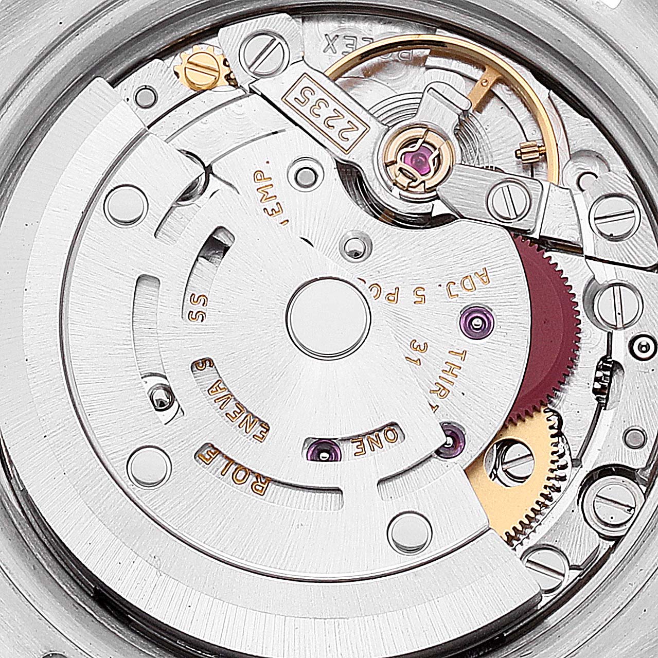 This close-up image of a Rolex Datejust 179171 Women's Steel and Gold (two tone) Silver Dial 179171 Women's Steel and Gold (two tone) Silver Dial watch shows the details of its movement and internal mechanical components.