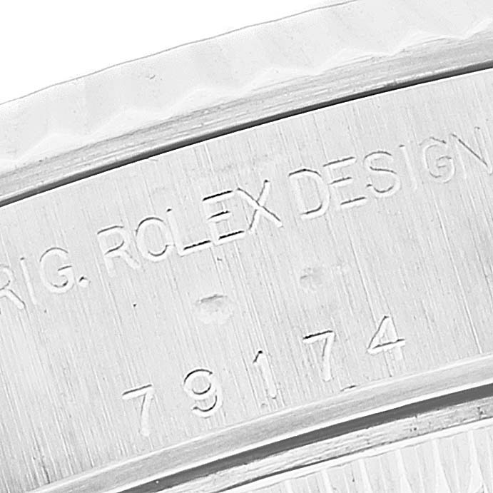 This image shows a close-up of the case back side of a Rolex Datejust 79174 Women's Stainless Steel Mother of Pearl Dial 79174 Women's Stainless Steel Mother of Pearl Dial model with visible engraved text and reference numbers.
