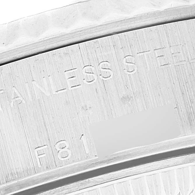 This close-up image shows the inside of the bezel with engravings on a Rolex Datejust 79174 Women's Stainless Steel Mother of Pearl Dial 79174 Women's Stainless Steel Mother of Pearl Dial watch.