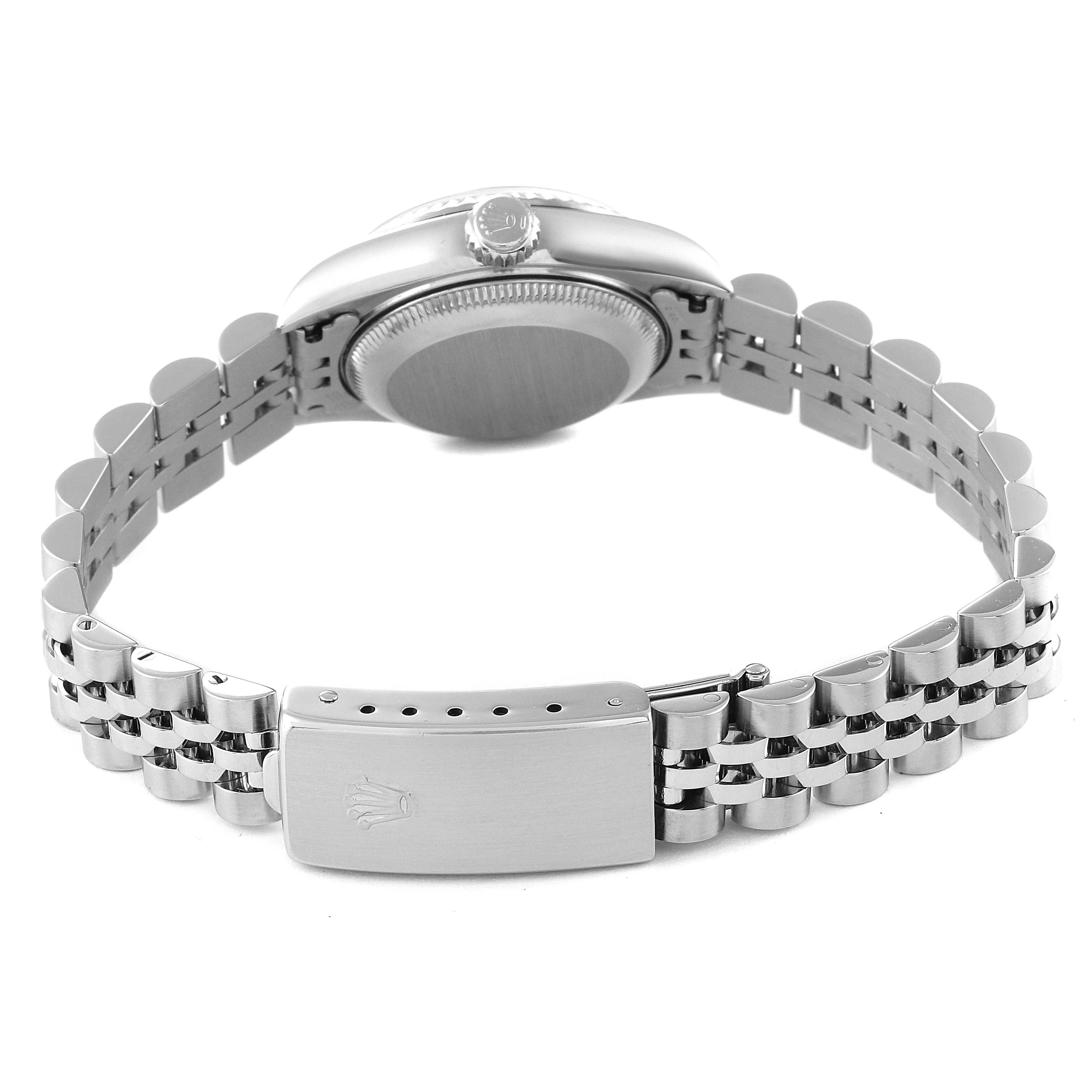 This Rolex Datejust 79174 Women's Stainless Steel Mother of Pearl Dial 79174 Women's Stainless Steel Mother of Pearl Dial watch is shown from the back, highlighting the bracelet and clasp, with a side view of the case.