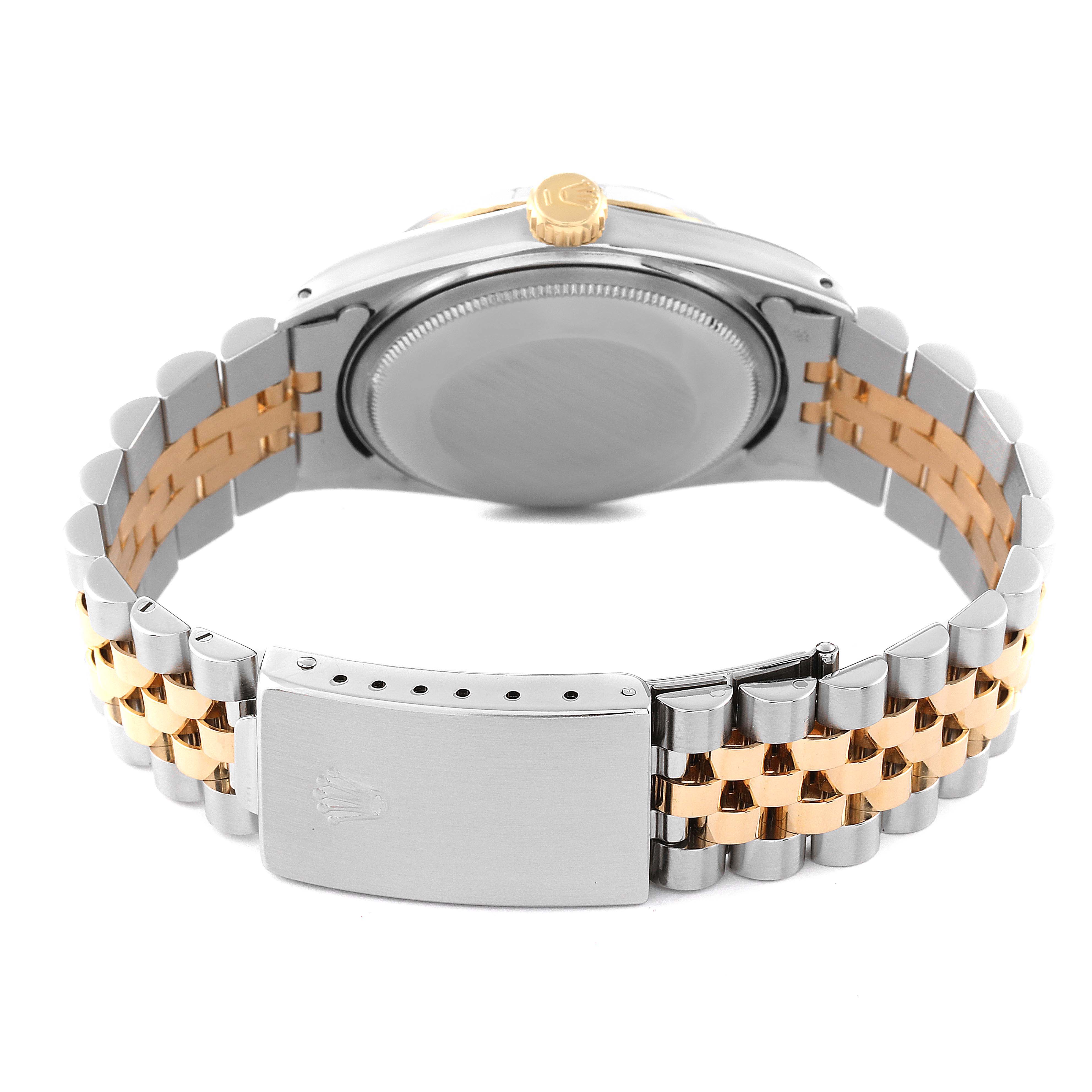 This image shows the back case and bracelet of a Rolex Vintage Collection 1601 Men's Steel and Gold (two tone) Black Dial 1601 Men's Steel and Gold (two tone) Black Dial watch, highlighting the clasp and back of the watch case.