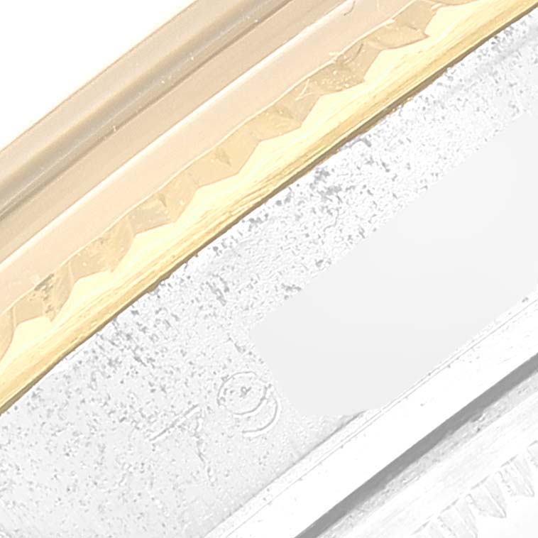 This image zooms in on the side of the bezel of the Vintage Collection model by Rolex, highlighting the detail and texture.