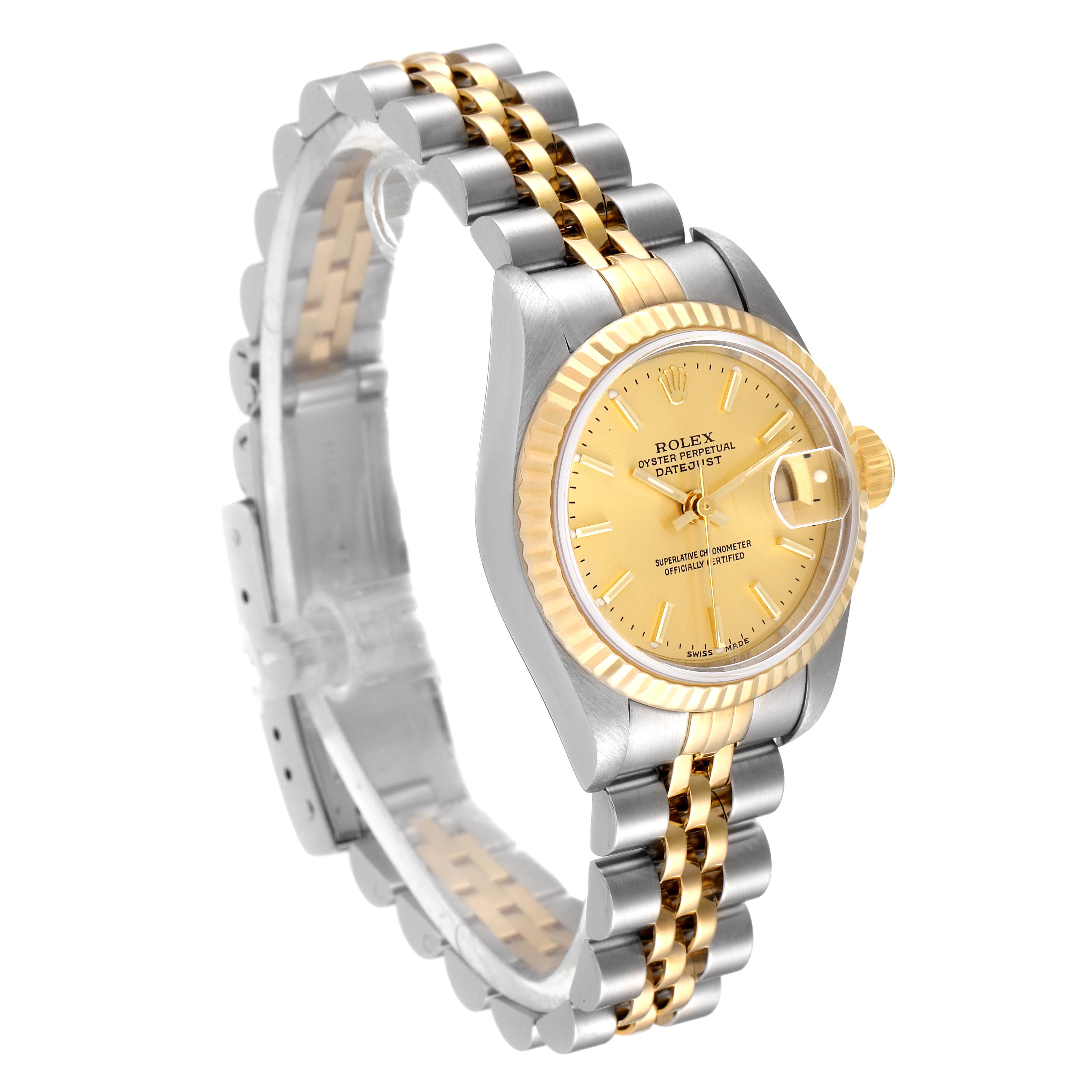 This image shows a side angle of a Rolex Datejust 79173 Women's Steel and Gold (two tone) Champagne Dial 79173 Women's Steel and Gold (two tone) Champagne Dial watch, highlighting the gold dial, fluted bezel, and two-tone jubilee bracelet.