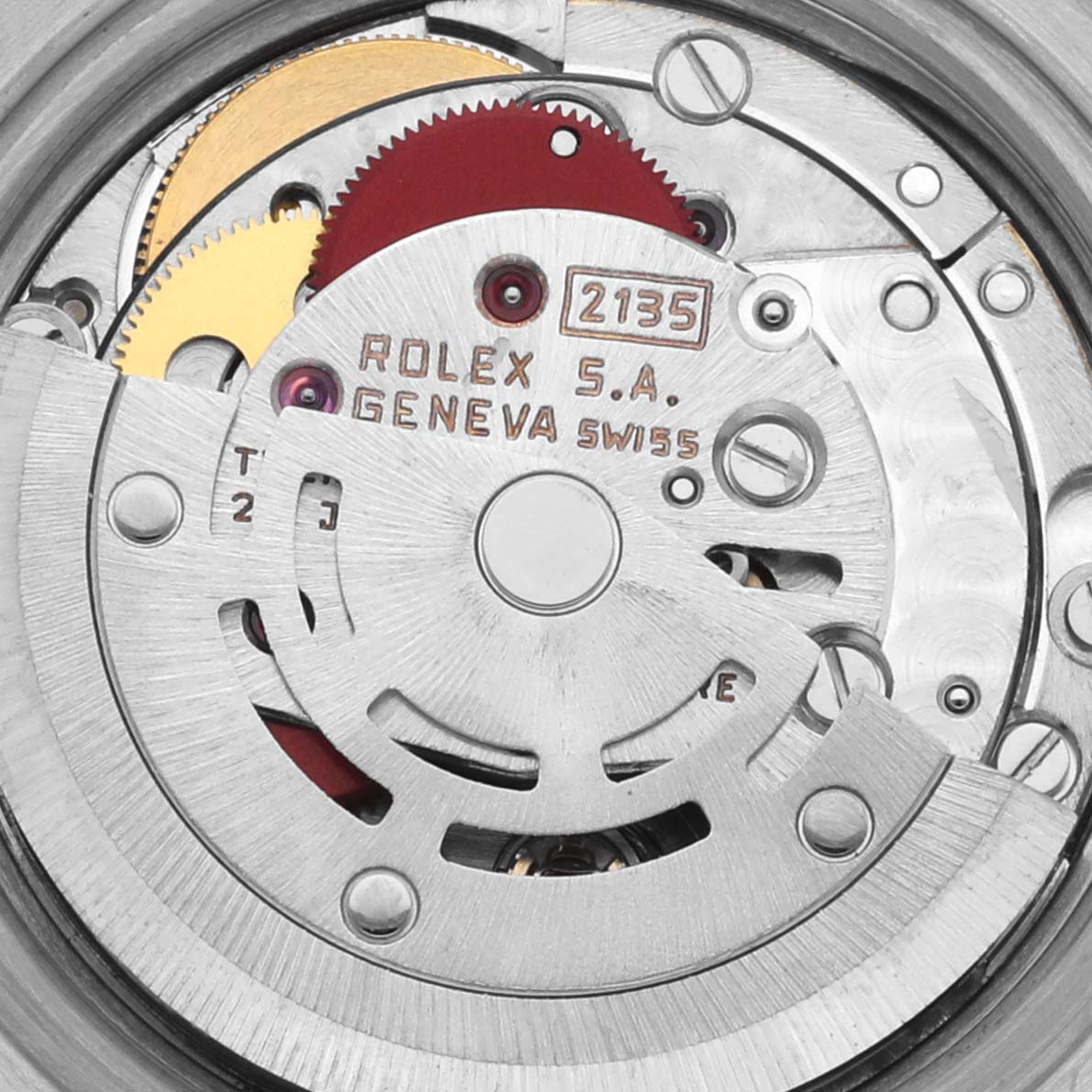 The image shows the movement of a Rolex Datejust 69173 Women's Steel and Gold (two tone) White Dial 69173 Women's Steel and Gold (two tone) White Dial, featuring gears and engraved details.