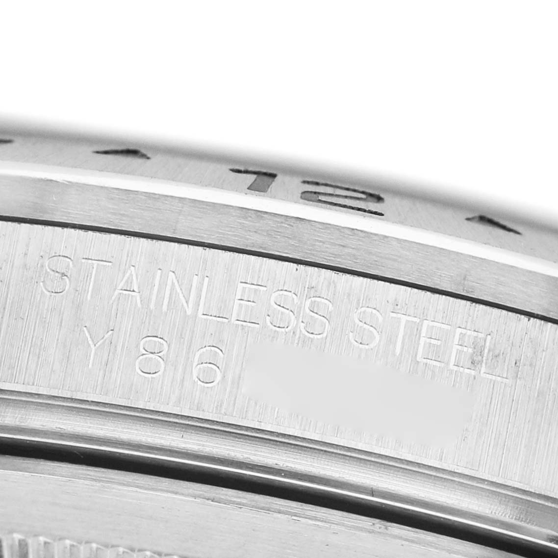 The image shows a close-up of the stainless steel case with engraved details on the Rolex Explorer 16570 Men's Stainless Steel Black Dial.