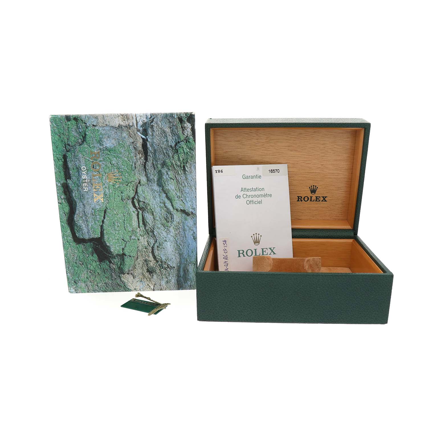 The image shows a Rolex Explorer 16570 Men's Stainless Steel Black Dial watch box, warranty card, and booklet from a top angle.