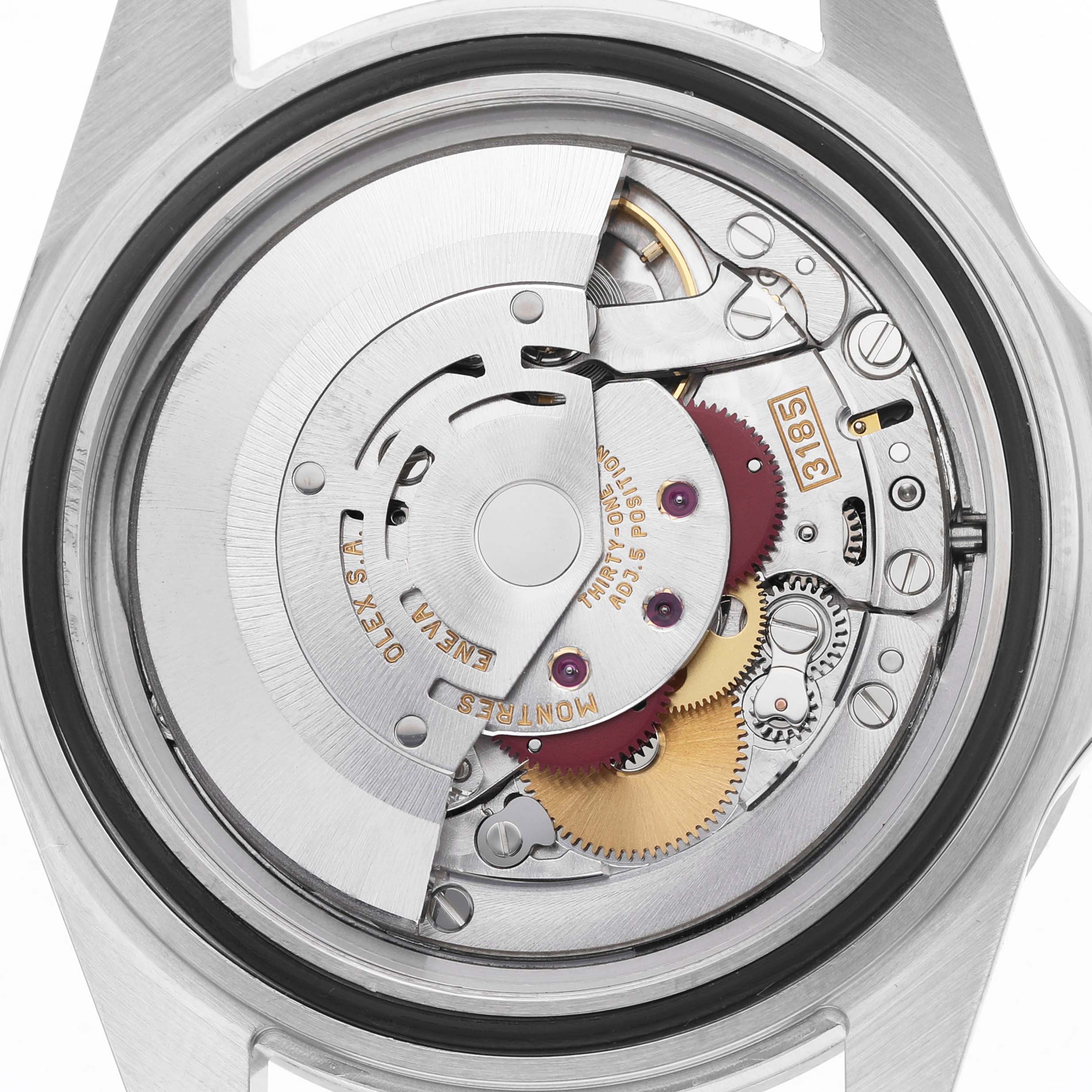 The image shows the movement of a Rolex Explorer 16570 Men's Stainless Steel Black Dial watch from a rear angle, showcasing its intricate mechanical parts.