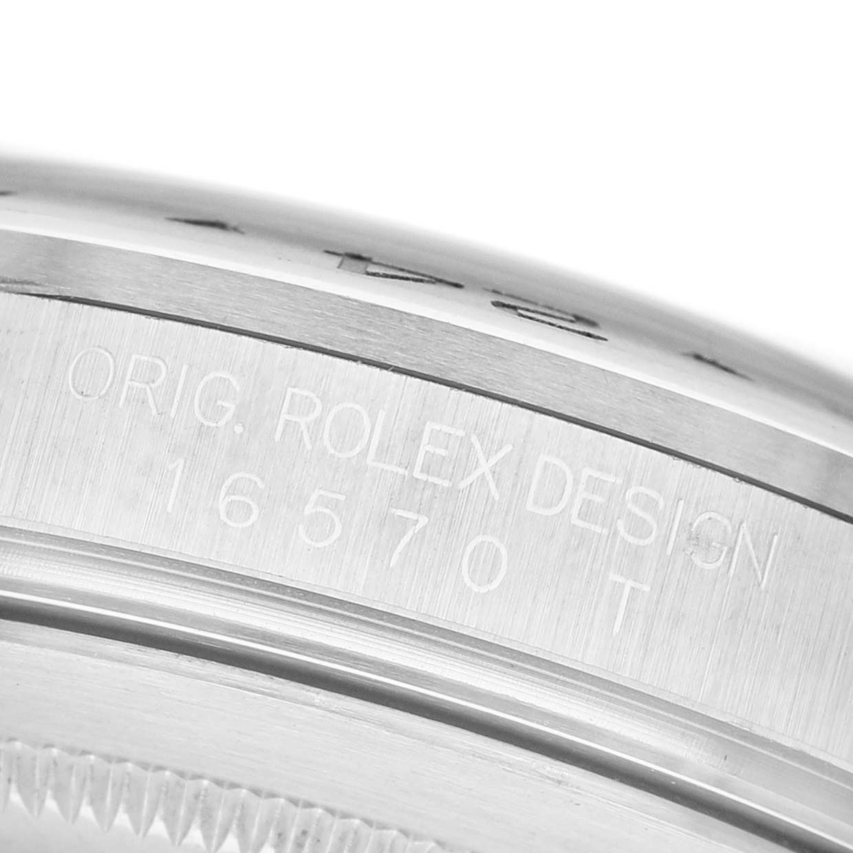 The image shows a close-up of the side of a Rolex Explorer 16570 Men's Stainless Steel Black Dial watch case with the model number 16570T engraved.