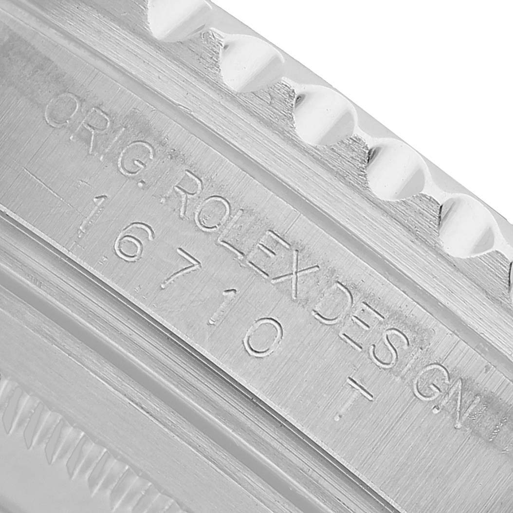 The image shows an engraving on the side case of a Rolex GMT-Master 16710 Men's Stainless Steel Black Dial with the model number 16710, viewed in close-up.