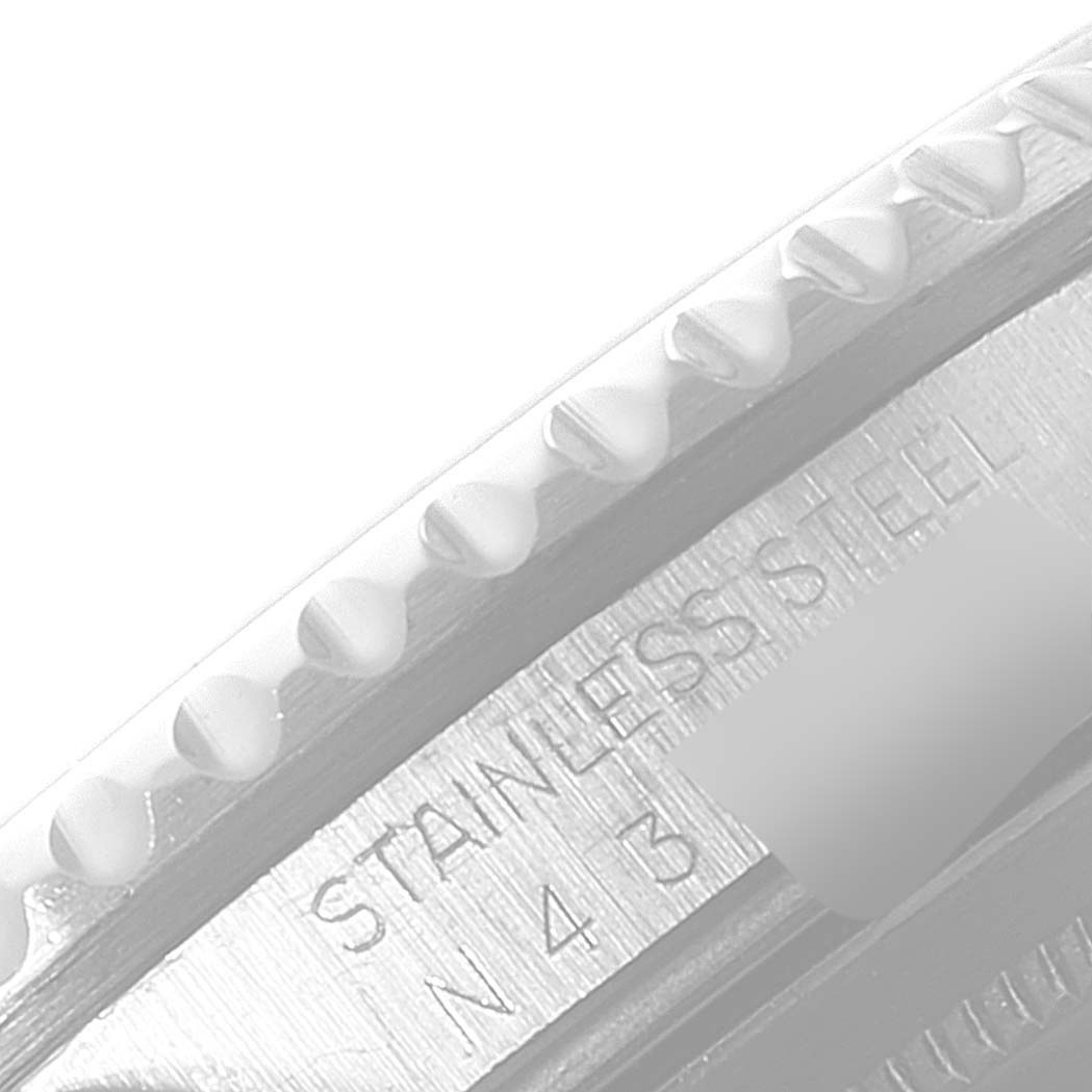 This close-up angle shows the engravings on the case side of a Rolex GMT-Master 16710 Men
s Stainless Steel Black Dial 16710 Men
s Stainless Steel Black Dial, highlighting "STAINLESS STEEL" text.