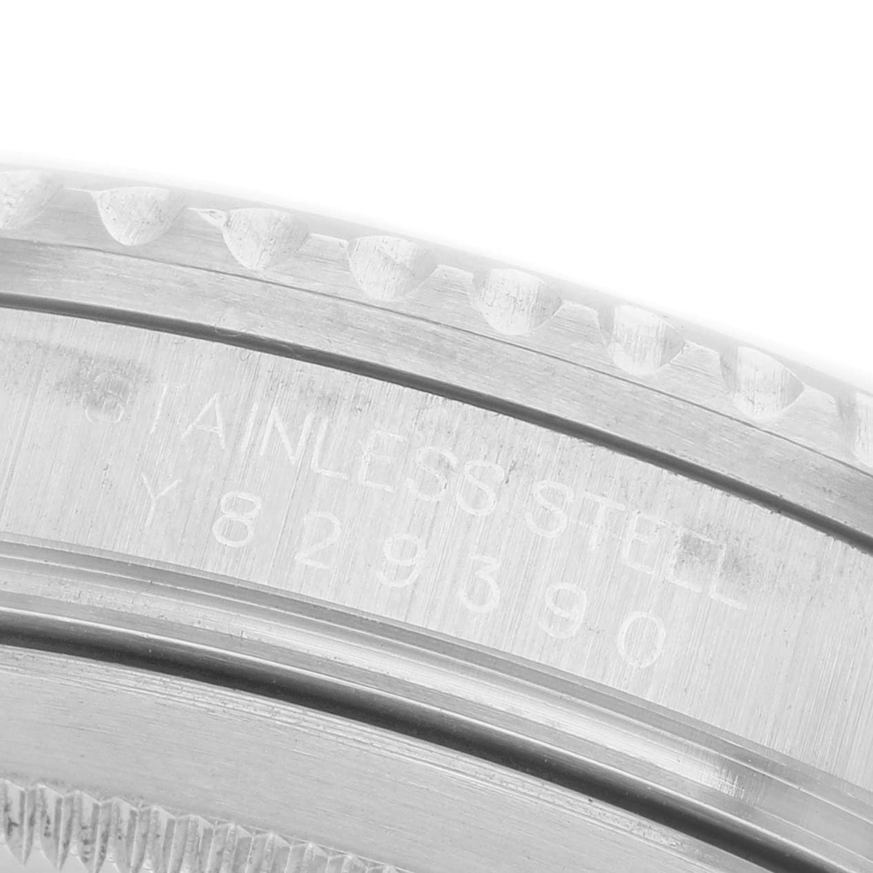 The image shows a close-up of the case side, focusing on the serial engraving of the Rolex GMT-Master 16710 Men's Stainless Steel Black Dial watch.