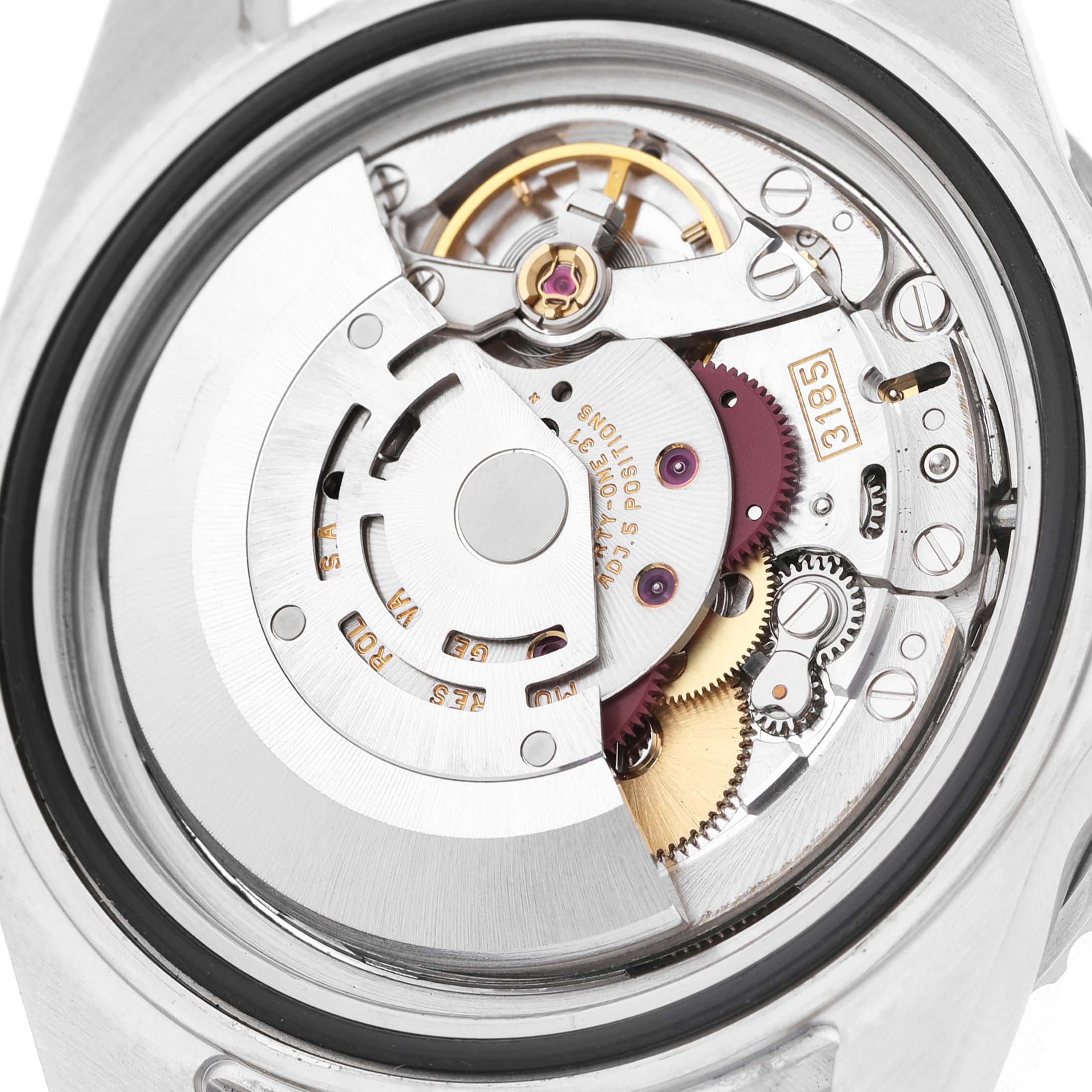 The image shows the movement of a Rolex GMT-Master 16710 Men's Stainless Steel Black Dial watch from a back angle, highlighting gears and intricate parts.