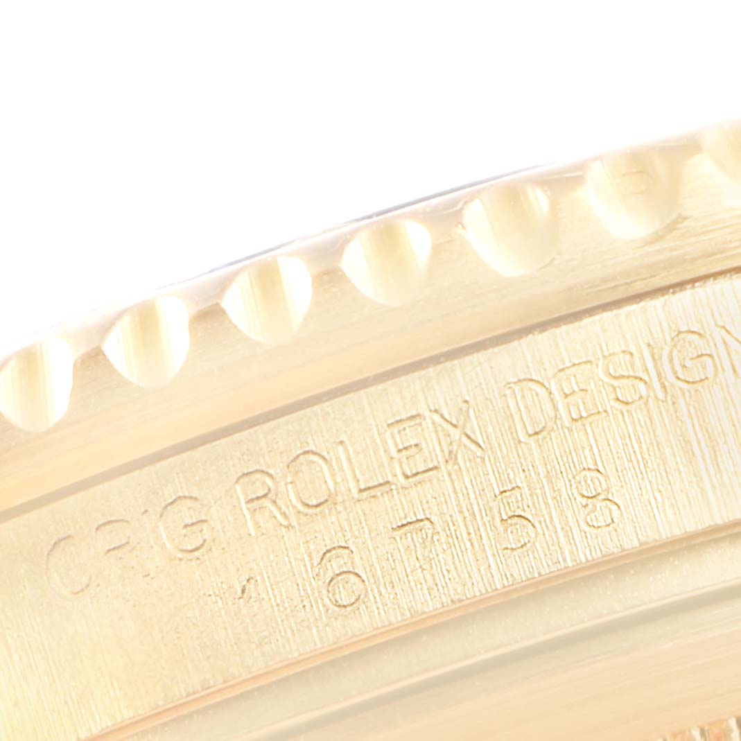 This image shows a close-up of the engraved bezel and side of a Rolex GMT-Master 16758 Men's Yellow Gold Brown Dial 16758 Men's Yellow Gold Brown Dial watch.
