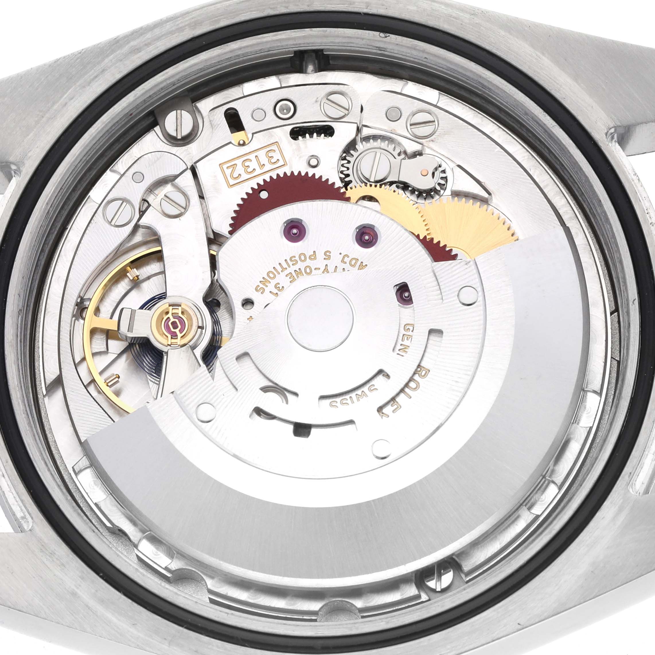 The image shows the back view of a Rolex Oyster Perpetual 114300 Men's Stainless Steel Blue Dial 114300 Men's Stainless Steel Blue Dial, revealing the movement mechanism and gears.