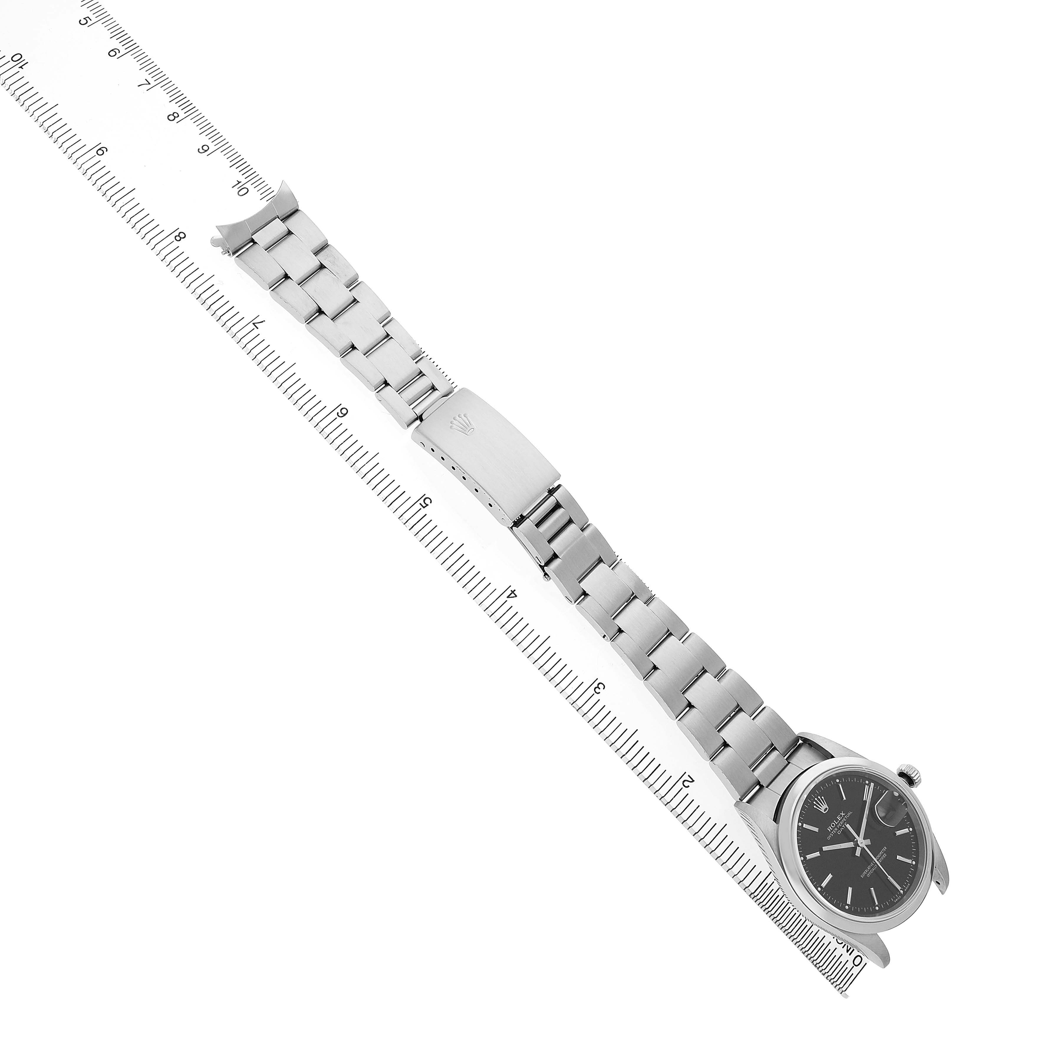 The Rolex Date 15200 Men's Stainless Steel Black Dial watch is shown at a diagonal top-down angle, featuring the bracelet and clasp.