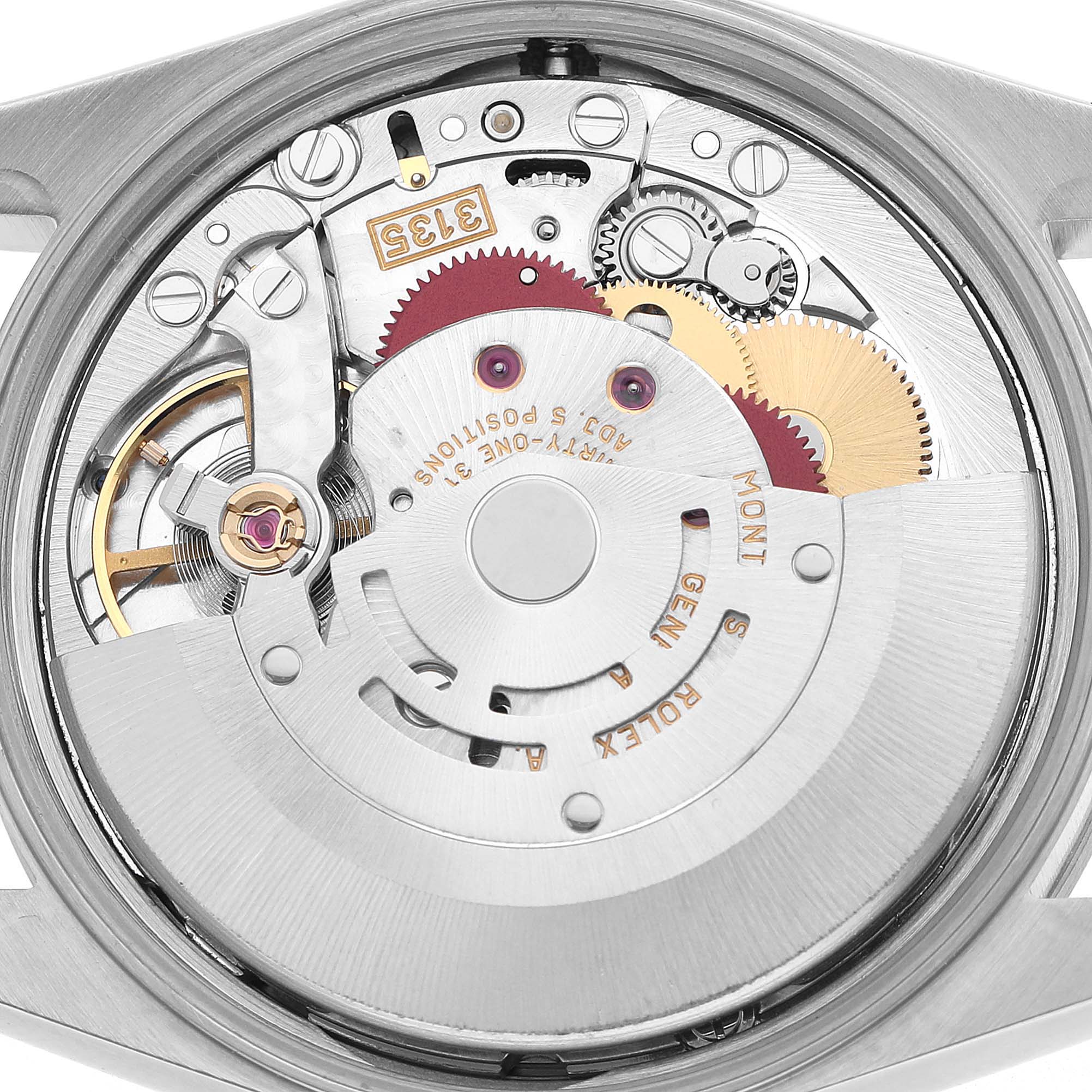 The image shows the movement and internal components of a Rolex Date 15200 Men's Stainless Steel Black Dial watch from a back view angle.