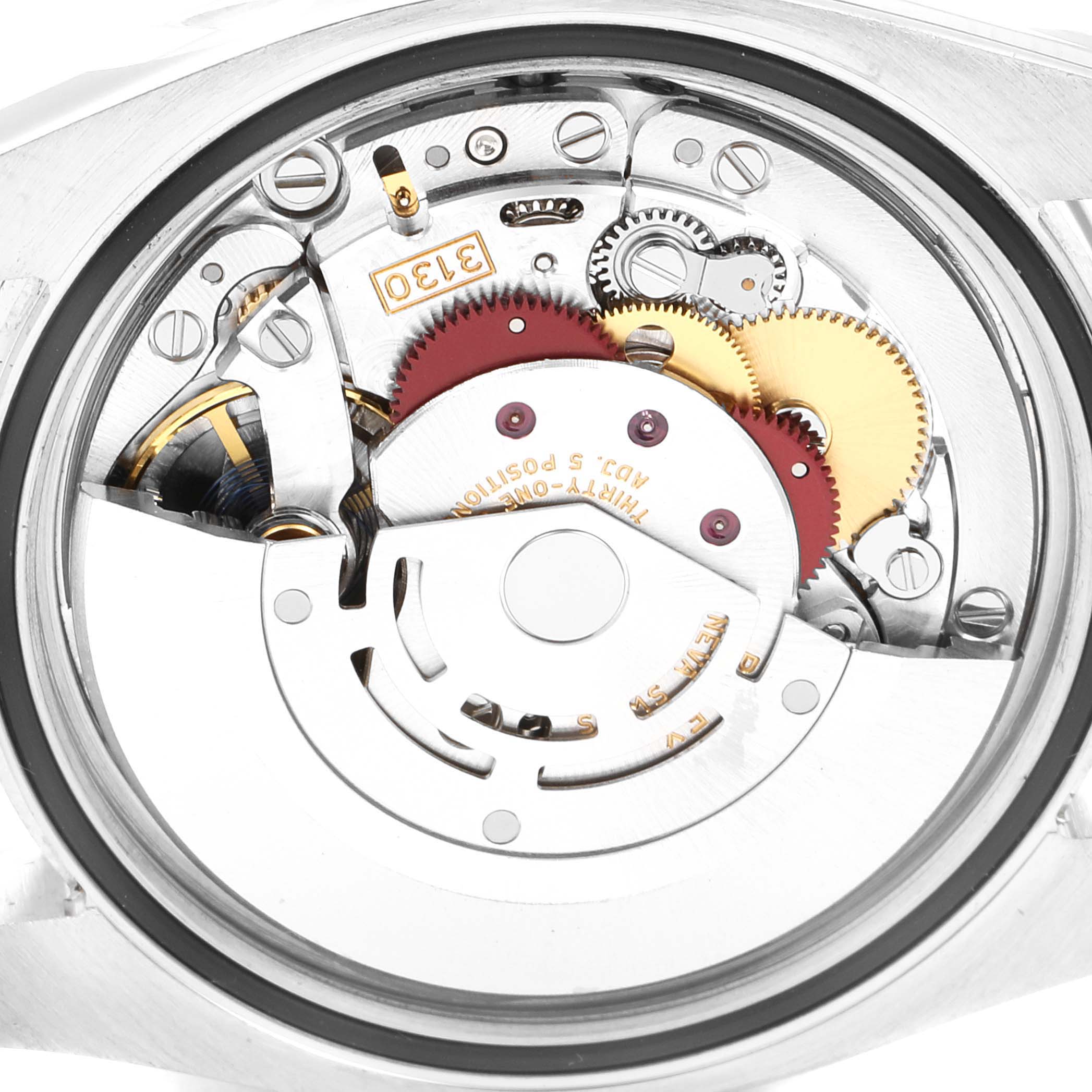 This image shows the inner mechanical components of a Rolex Oyster Perpetual 116000 Men's Stainless Steel Silver Dial 116000 Men's Stainless Steel Silver Dial watch from a rear, open-back angle.