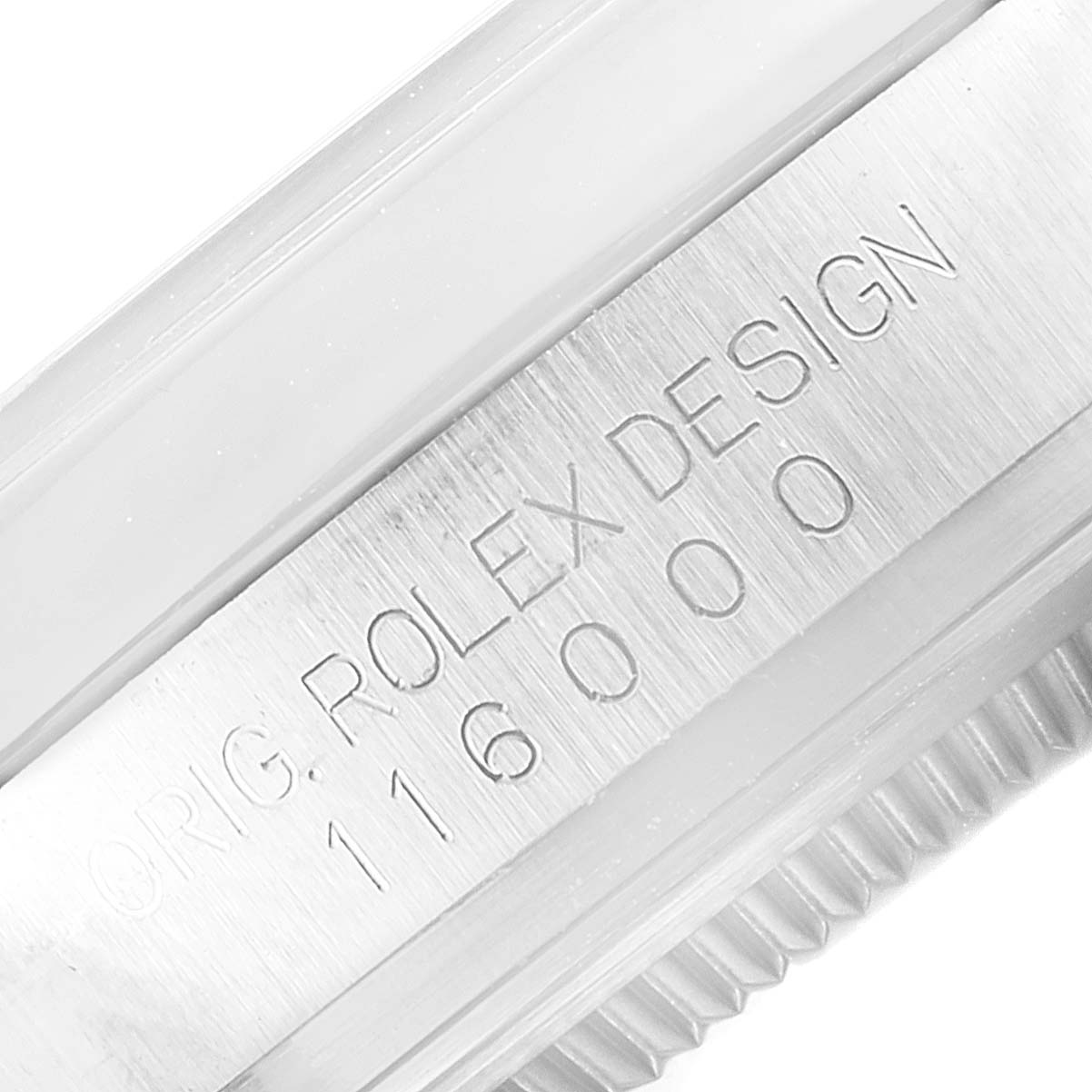 This image shows the side view of a Rolex Oyster Perpetual 116000 Men's Stainless Steel Silver Dial 116000 Men's Stainless Steel Silver Dial watch, highlighting the engraved model number and "ROLEX DESIGN".