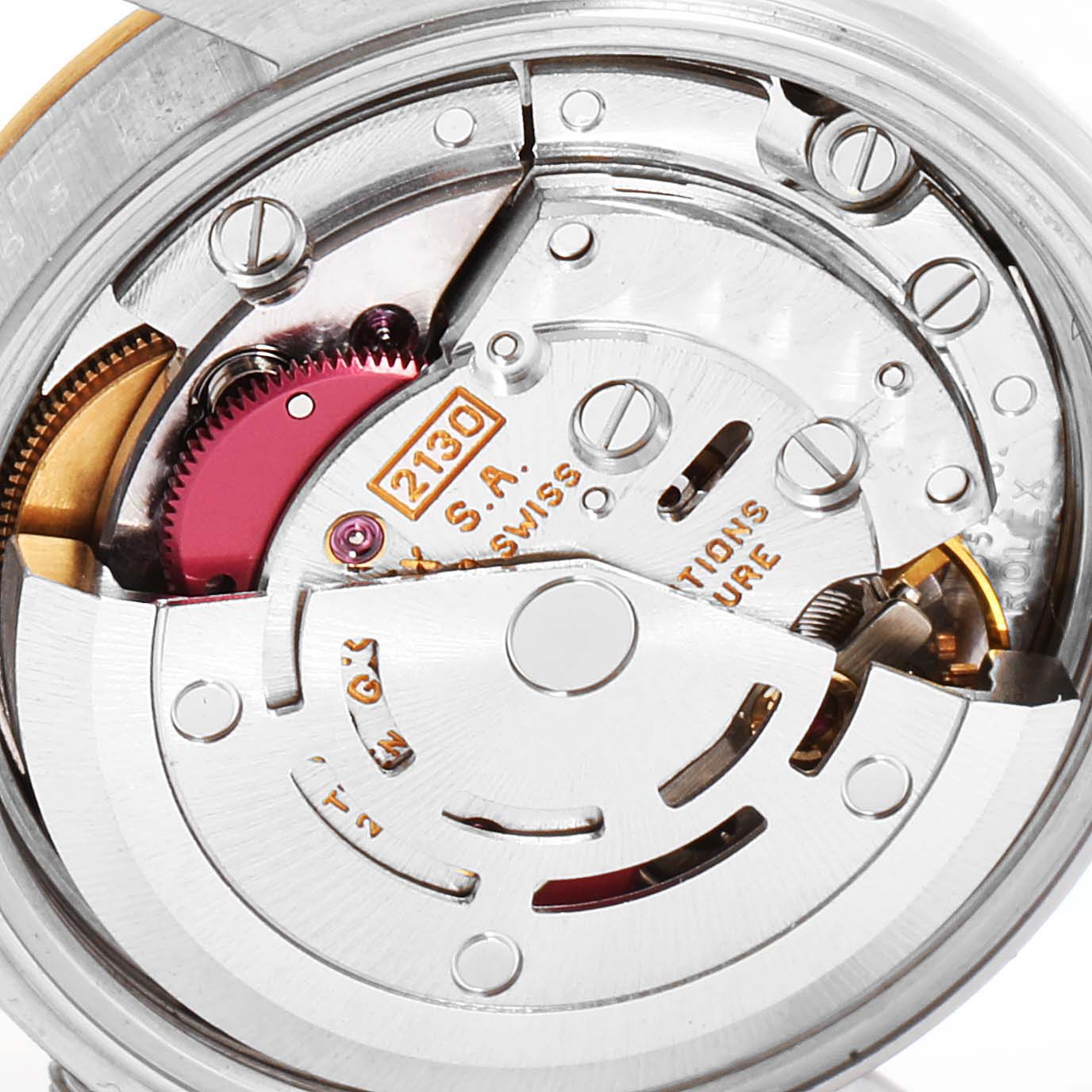 The image shows a close-up of the movement mechanism of the Rolex Oyster Perpetual 67193 Women's Stainless Steel Champagne Dial 67193 Women's Stainless Steel Champagne Dial watch.