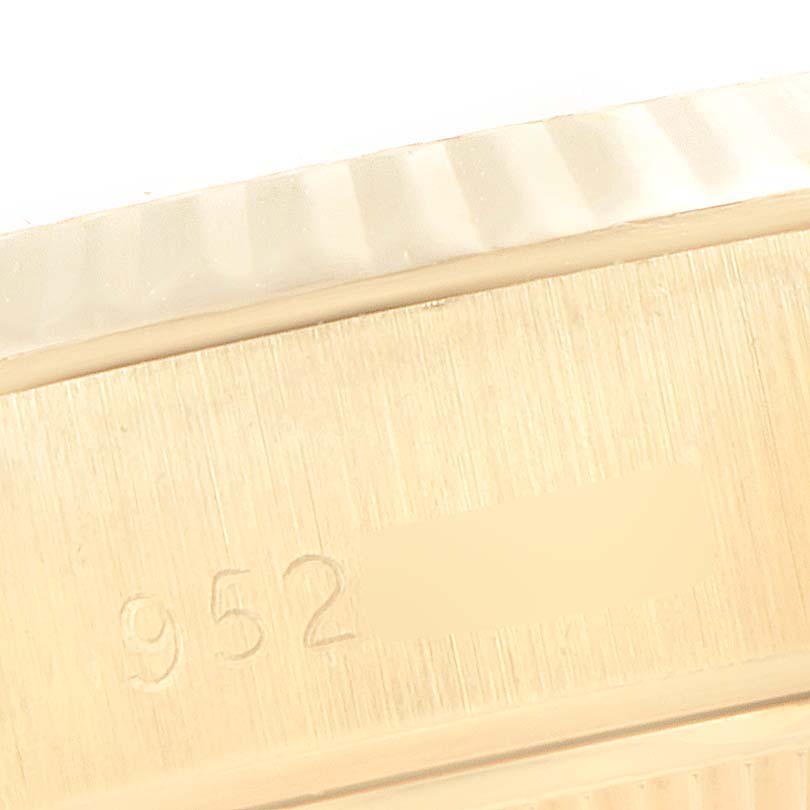 This image shows a close-up of the edge of the case back with part of the reference number on a Rolex President 69178 Women's Yellow Gold Champagne Dial 69178 Women's Yellow Gold Champagne Dial model watch.