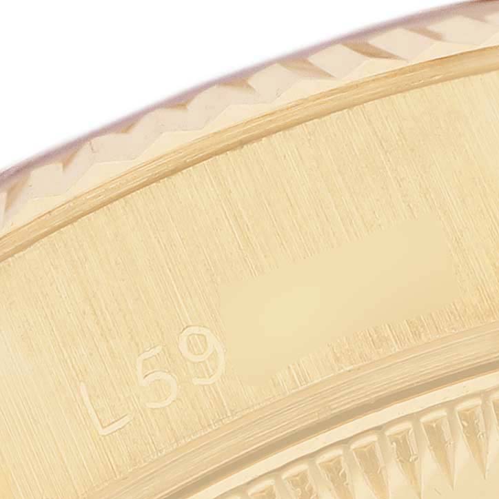 This image shows a close-up of the fluted bezel and edge details of a Rolex President 69178 Women's Yellow Gold Champagne Dial watch.