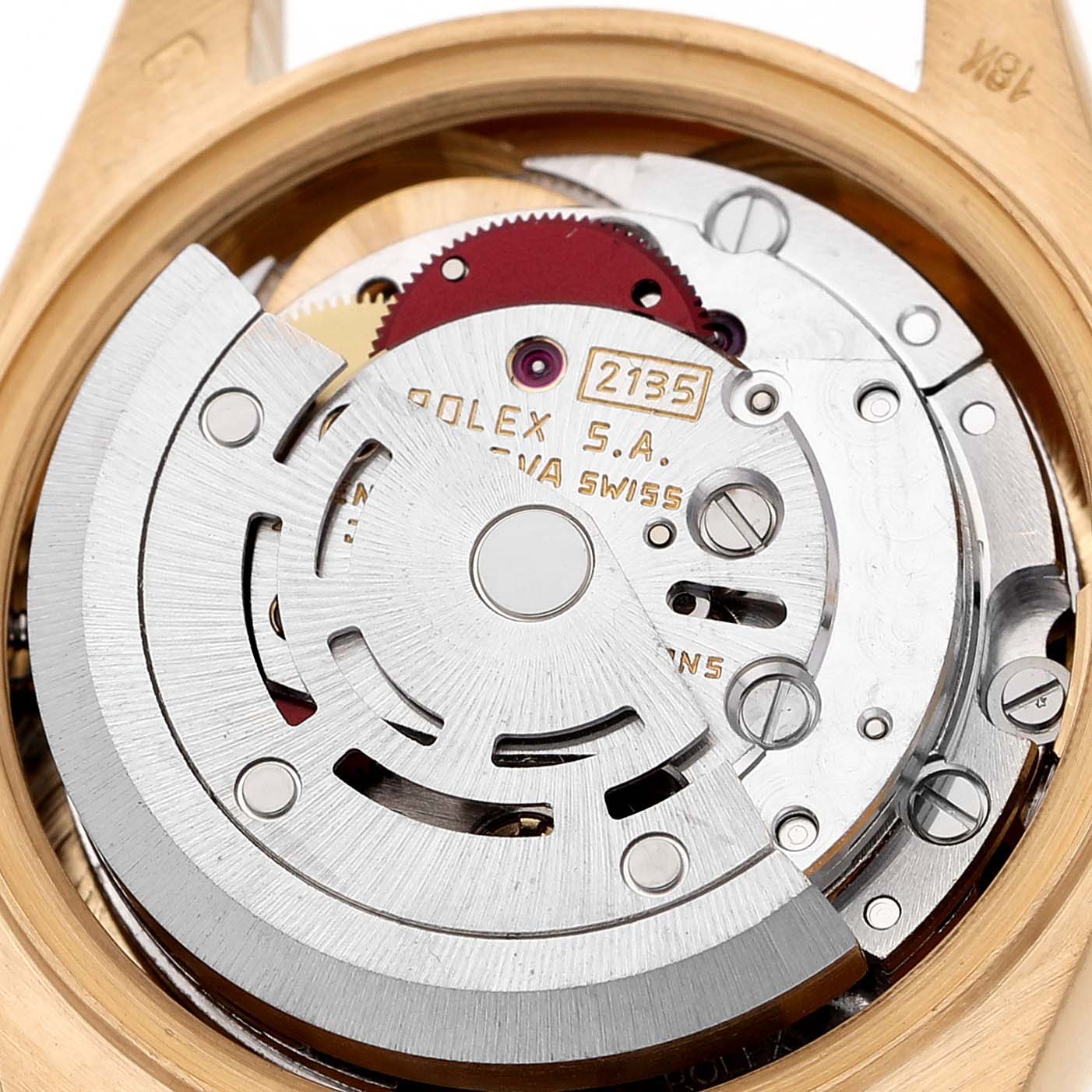 The image shows the movement of a Rolex President 69178 Women's Yellow Gold Champagne Dial watch with its intricate components viewed from the back.
