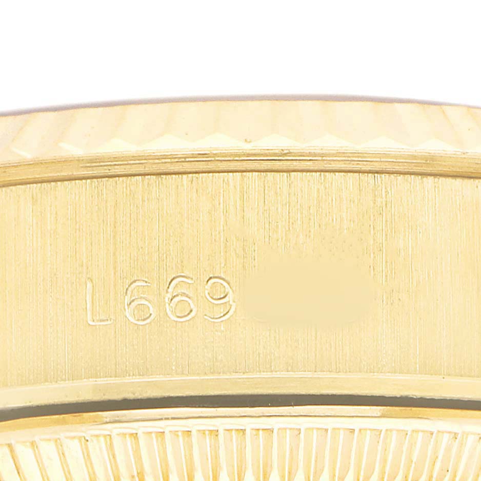 The image shows a close-up of the side of a gold Rolex President 69178 Men's Yellow Gold Champagne Dial watch, highlighting the engraved reference number.