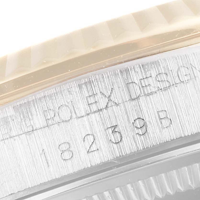 This close-up image shows the bezel and case side with engravings of a Rolex President 18239 Men's White Gold Brown Dial 18239 Men's White Gold Brown Dial model watch.