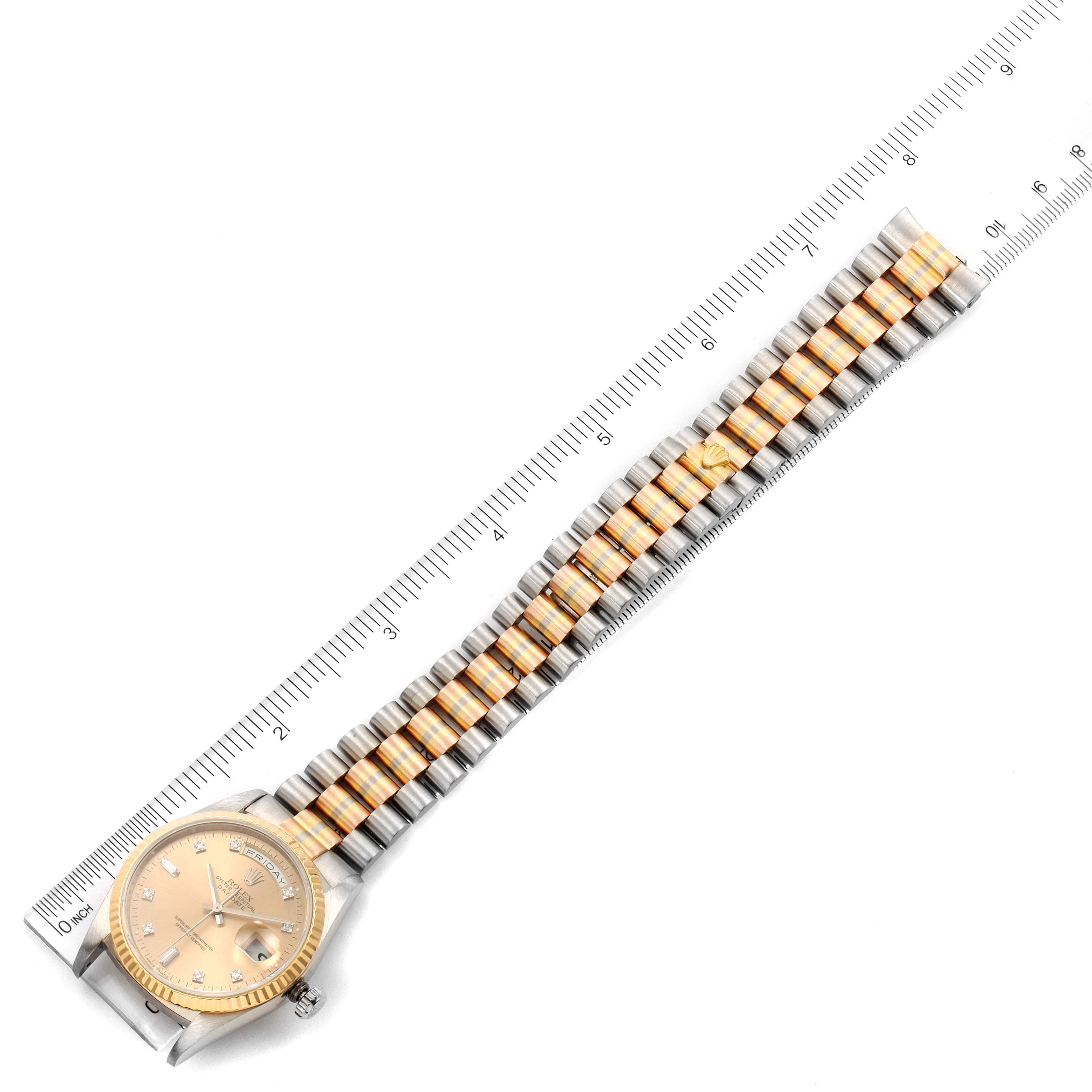 This image shows a Rolex President 18239 Men's White Gold Brown Dial 18239 Men's White Gold Brown Dial model watch laid flat with its face and bracelet visible, next to a ruler for scale.
