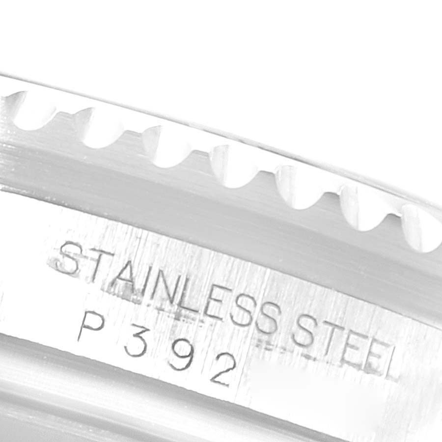 The image shows a close-up of the stainless steel outer bezel and part of the case back of a Rolex Sea-Dweller 16600 Men
s Stainless Steel Black Dial 16600 Men
s Stainless Steel Black Dial watch.