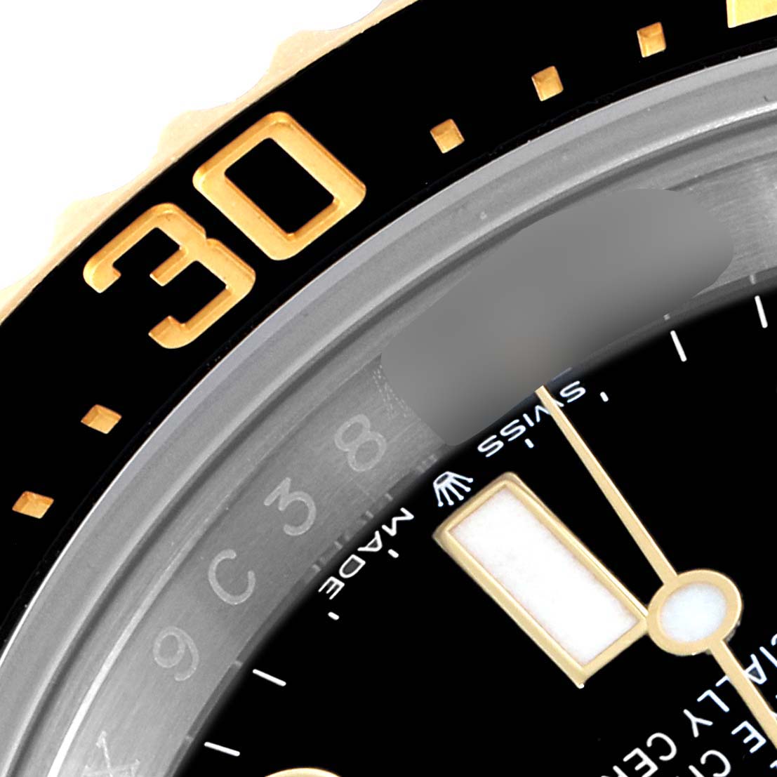 This close-up angle of the Rolex Sea-Dweller 126603 Men's Steel and Gold (two tone) Black Dial 126603 Men's Steel and Gold (two tone) Black Dial watch shows part of the bezel, dial, minute hand, and hour marker.