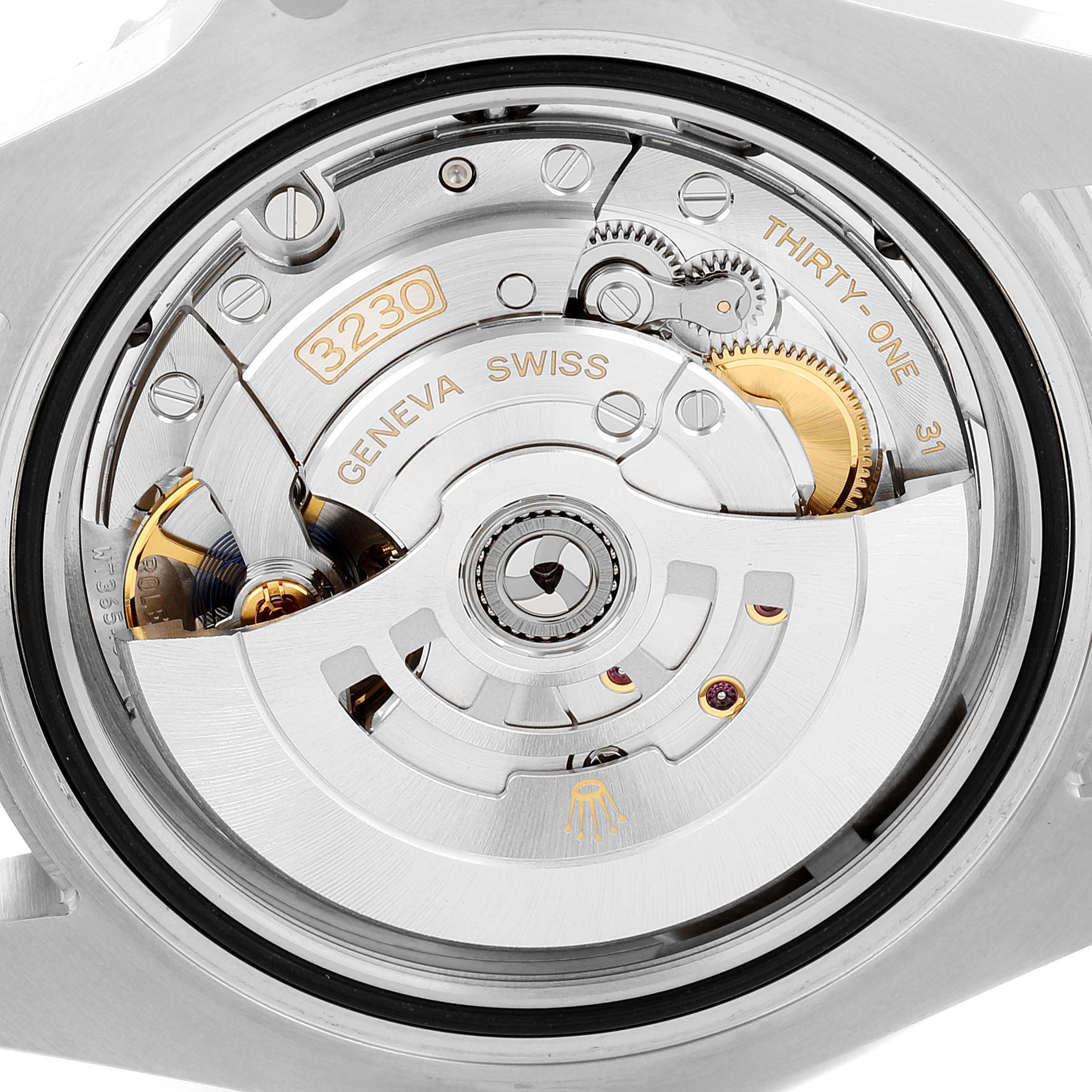 The image shows the inner mechanism of a Rolex Submariner 124060 Men
s Stainless Steel Black Dial 124060 Men
s Stainless Steel Black Dial watch, highlighting its Geneva Swiss movement and rotor.