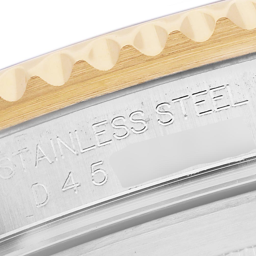 The image shows a close-up of the edge and bezel of a Rolex Submariner 16613 Men's Steel and Gold (two tone) Silver Dial 16613 Men's Steel and Gold (two tone) Silver Dial watch, highlighting the gold and stainless steel parts.