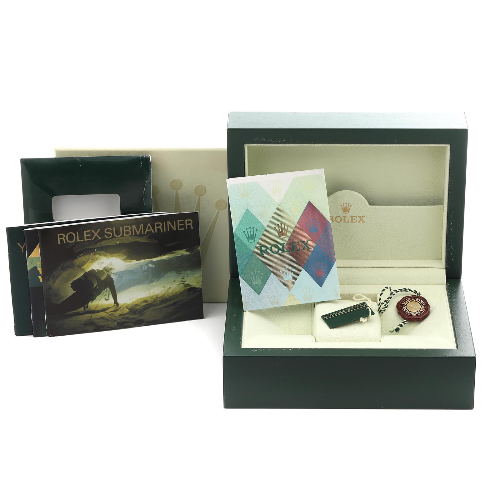 The image shows the Rolex Submariner 16613 Men's Steel and Gold (two tone) Silver Dial 16613 Men's Steel and Gold (two tone) Silver Dial packaging with manuals, tags, and papers inside an open green box.