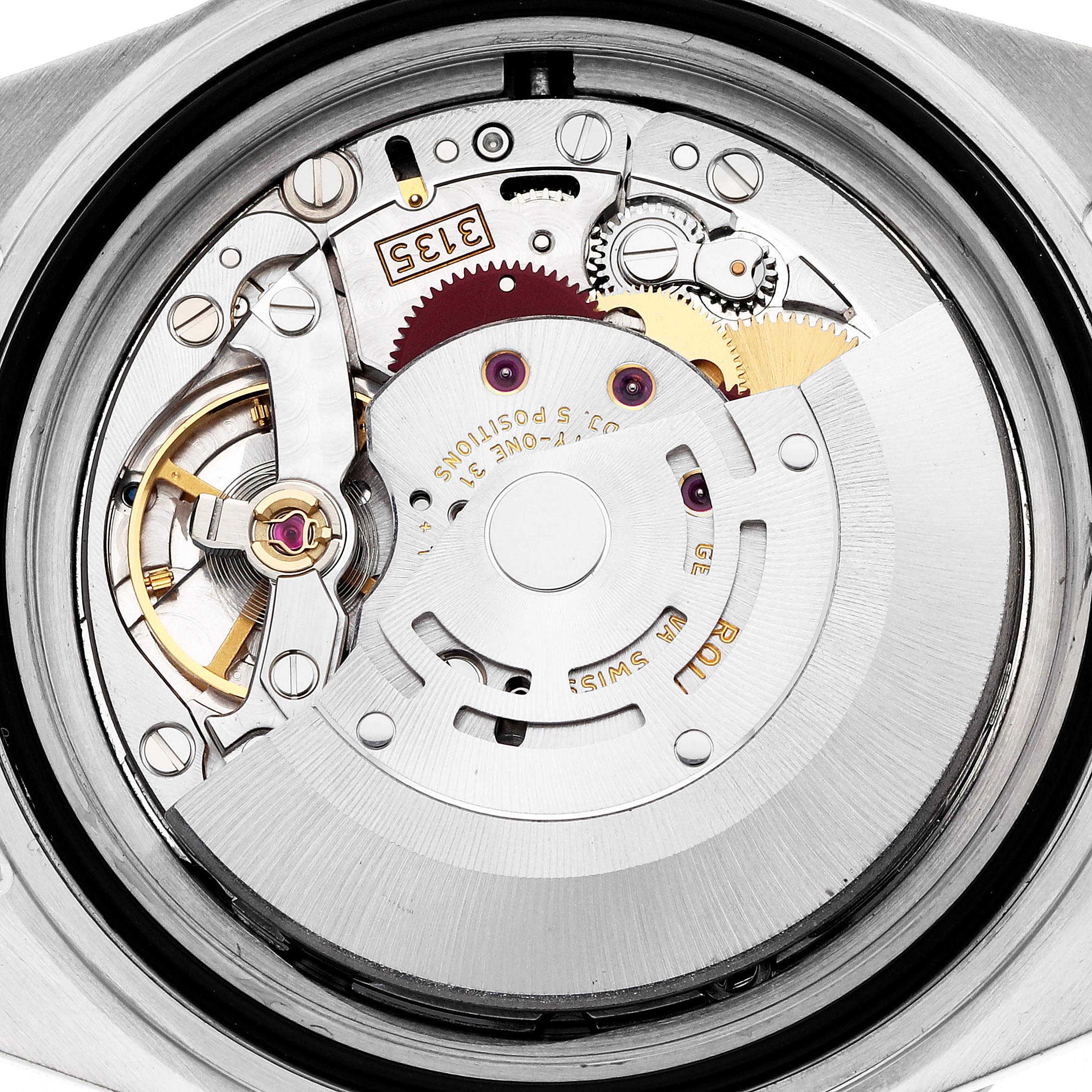The image shows the movement of a Rolex Submariner 16613 Men's Steel and Gold (two tone) Silver Dial 16613 Men's Steel and Gold (two tone) Silver Dial watch from the back, highlighting gears and inner mechanisms.