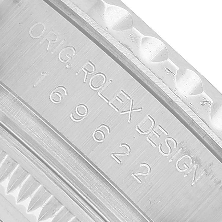 The image shows a close-up of the Rolex Yacht-Master 169622 Women's Stainless Steel Silver Dial model case side with engraved serial numbers.