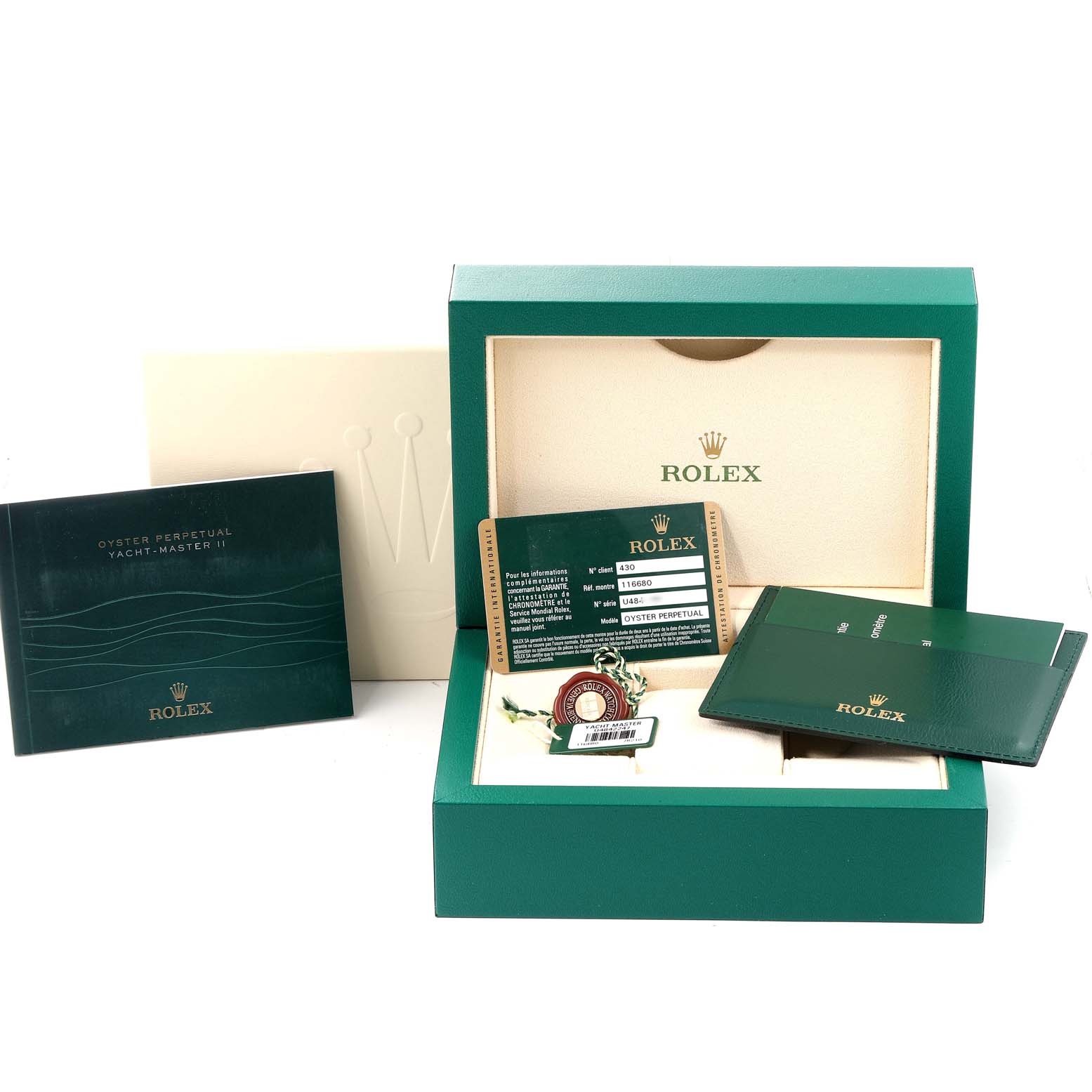 The image shows the packaging and accessories of a Rolex Yacht-Master 116680 Men's Stainless Steel White Dial 116680 Men's Stainless Steel White Dial watch, including manuals, a warranty card, and a green box.