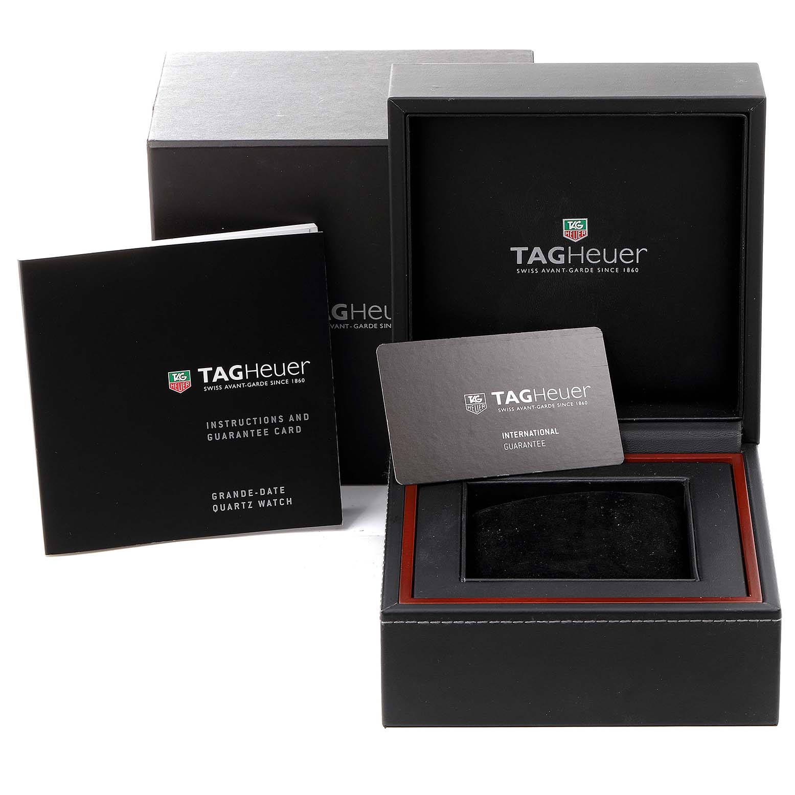 The image shows the Tag Heuer Aquaracer WAP111Z.BA0831 Men
s Stainless Steel Black Dial WAP111Z.BA0831 Men
s Stainless Steel Black Dial watch box, instructions, and guarantee card from a front angle.