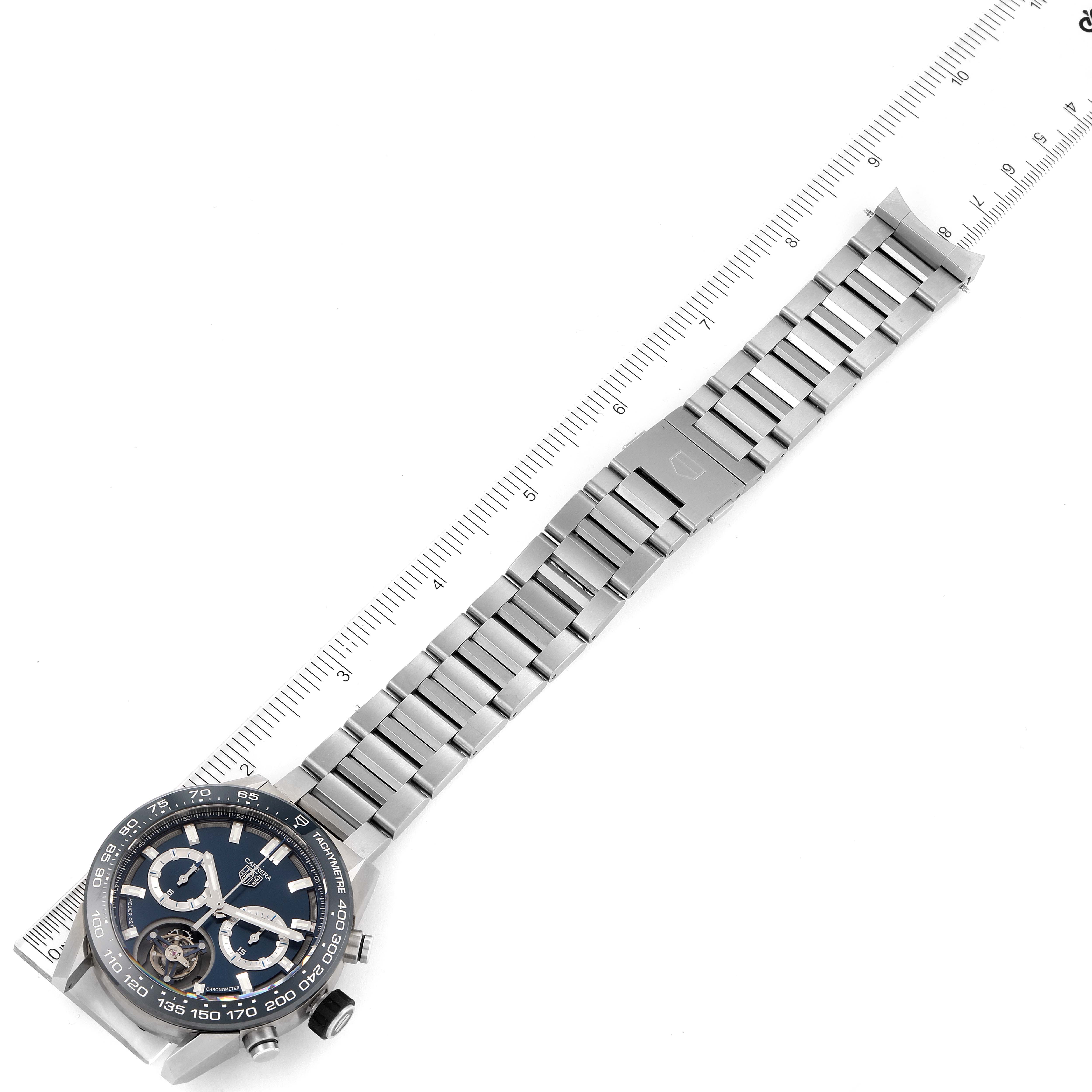 The image shows a top-down view of a Tag Heuer Carrera CAR5A8C.BF0707 Men's Titanium Blue Dial CAR5A8C.BF0707 Men's Titanium Blue Dial watch and its stainless steel bracelet laid alongside a ruler.