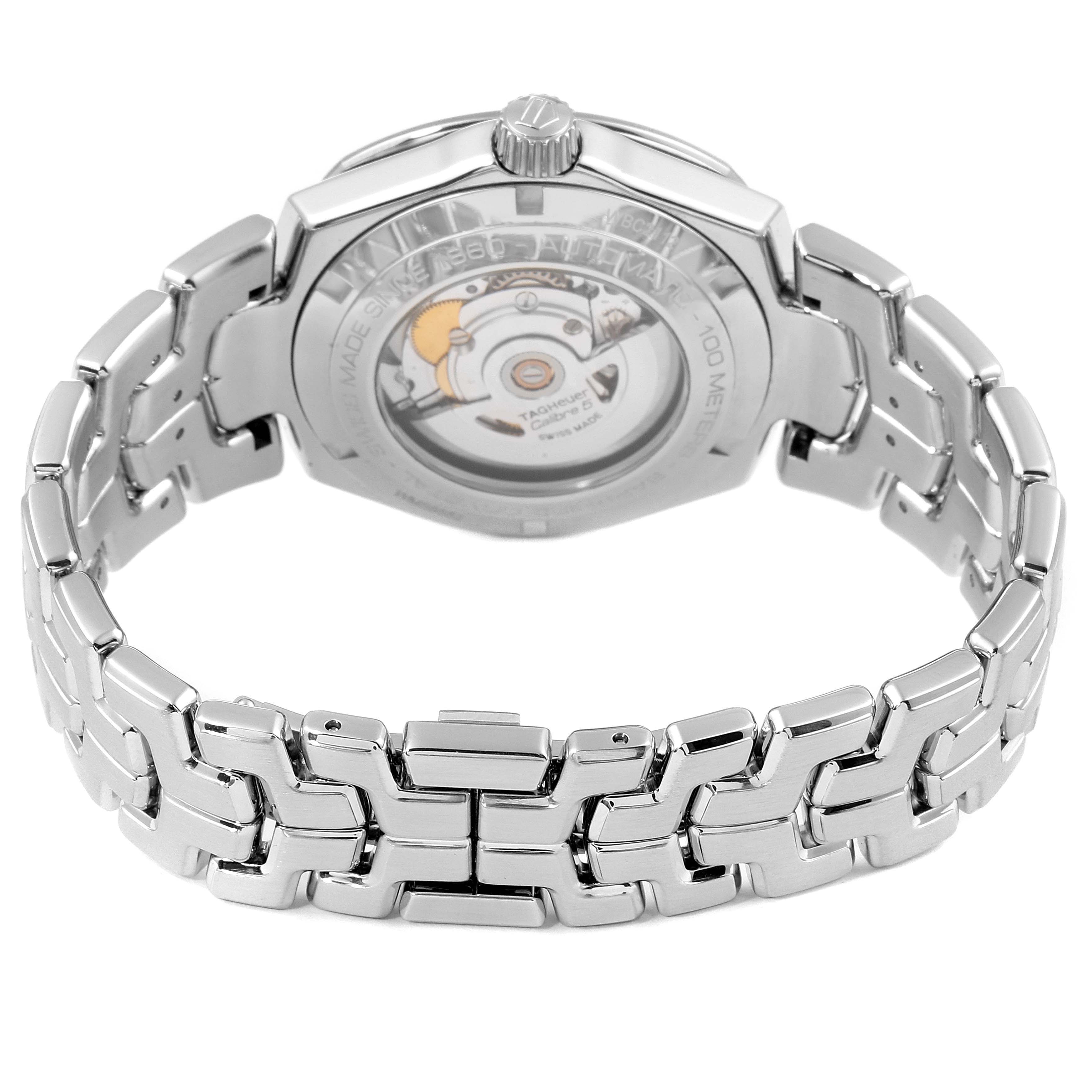 The image shows the back view of a Tag Heuer Link WBC2112.BA0603 Men's Stainless Steel Blue Dial WBC2112.BA0603 Men's Stainless Steel Blue Dial model watch, highlighting its open case back and metal bracelet.