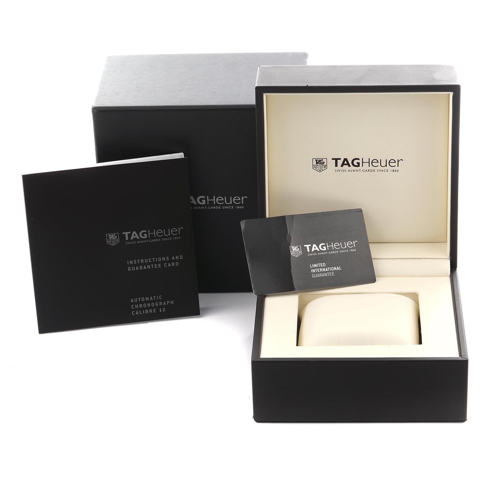 The image shows a Tag Heuer Monaco CAW2111-0 Men's Stainless Steel Blue Dial CAW2111-0 Men's Stainless Steel Blue Dial box with guarantee card and instruction booklet, viewed from the front and top.