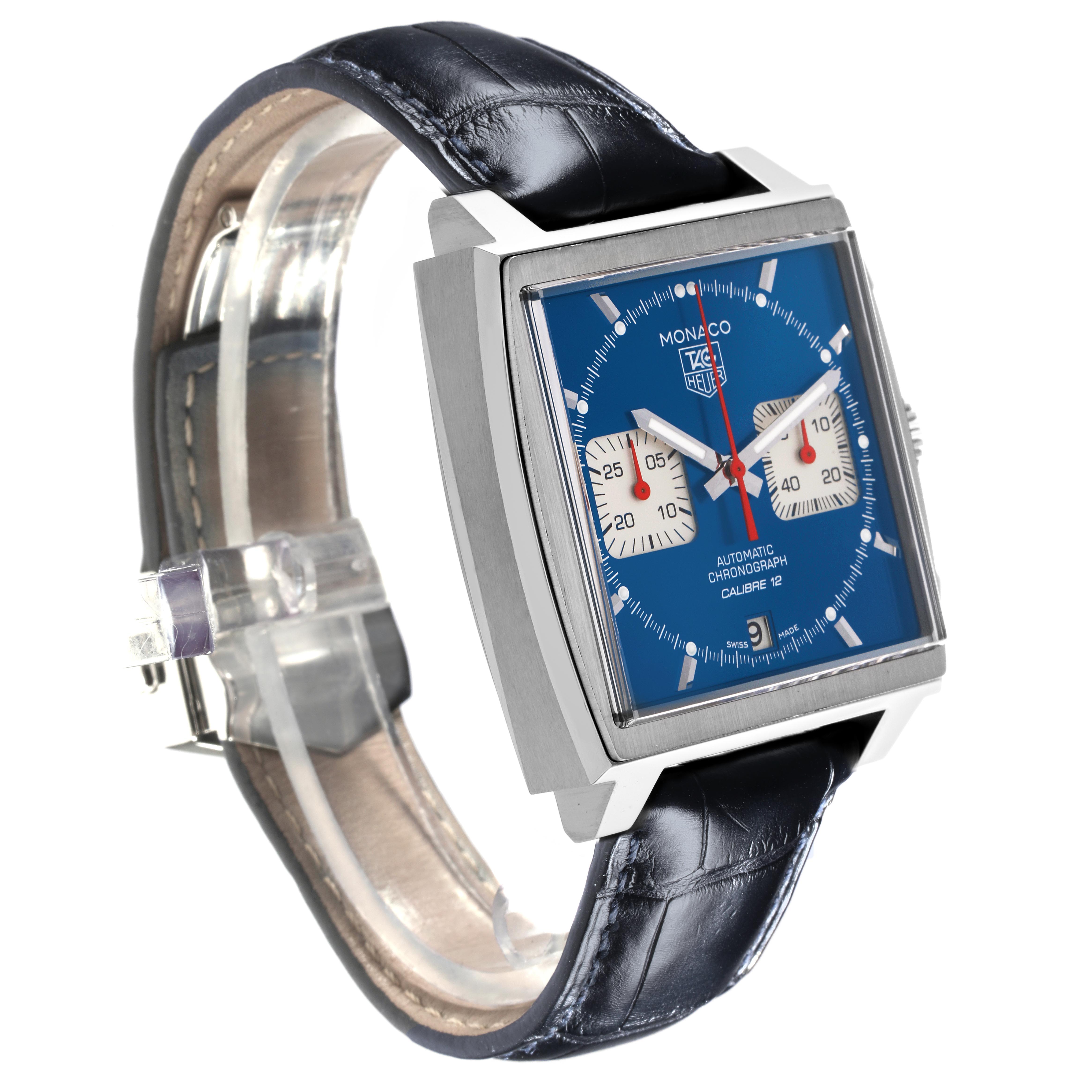 The Tag Heuer Monaco CAW2111-0 Men's Stainless Steel Blue Dial CAW2111-0 Men's Stainless Steel Blue Dial watch is shown at a three-quarter angle, highlighting its blue dial, square case, and black leather strap.
