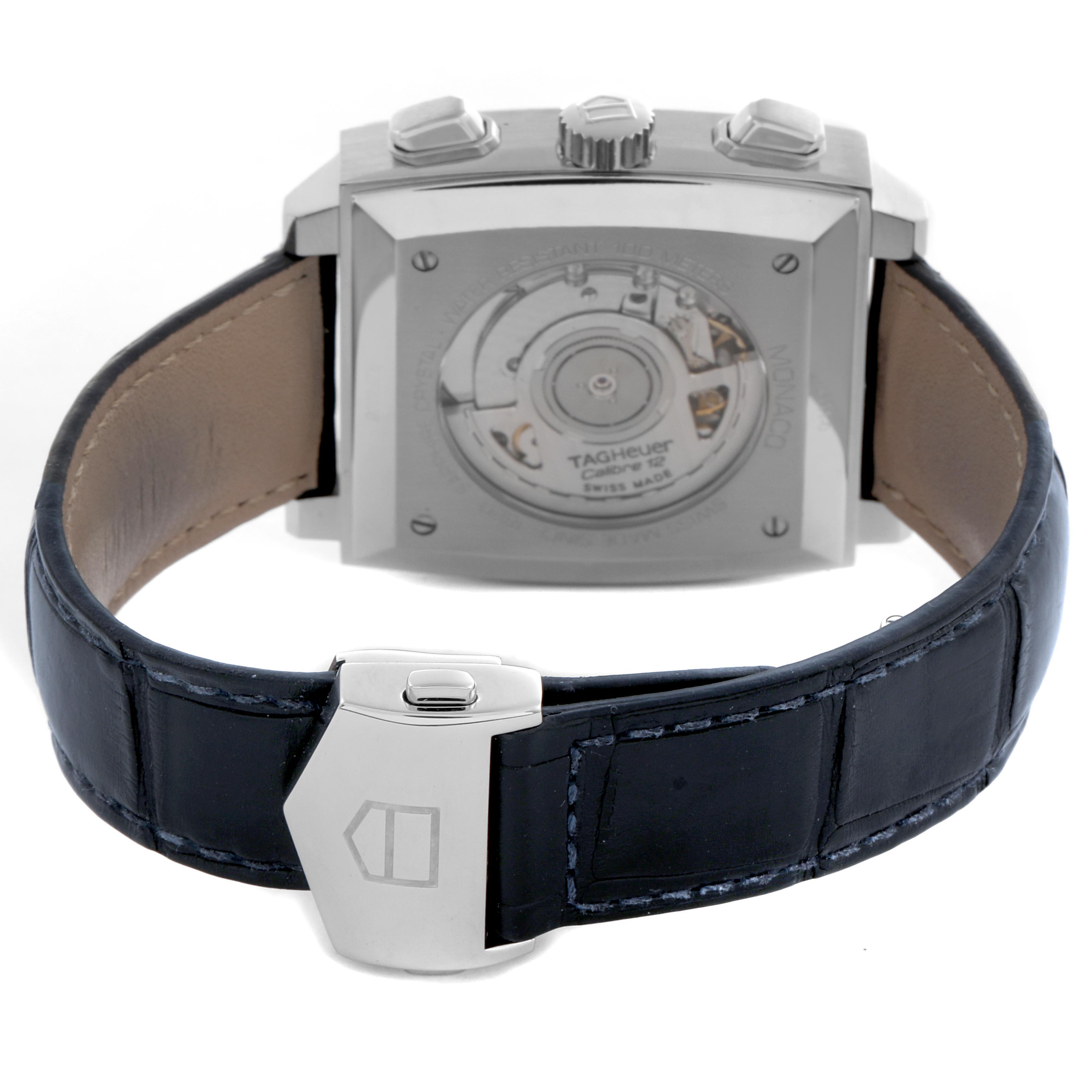 The image shows the back of a Tag Heuer Monaco CAW2111-0 Men's Stainless Steel Blue Dial CAW2111-0 Men's Stainless Steel Blue Dial watch, highlighting the case back, movement, crown, and clasp on the leather strap.