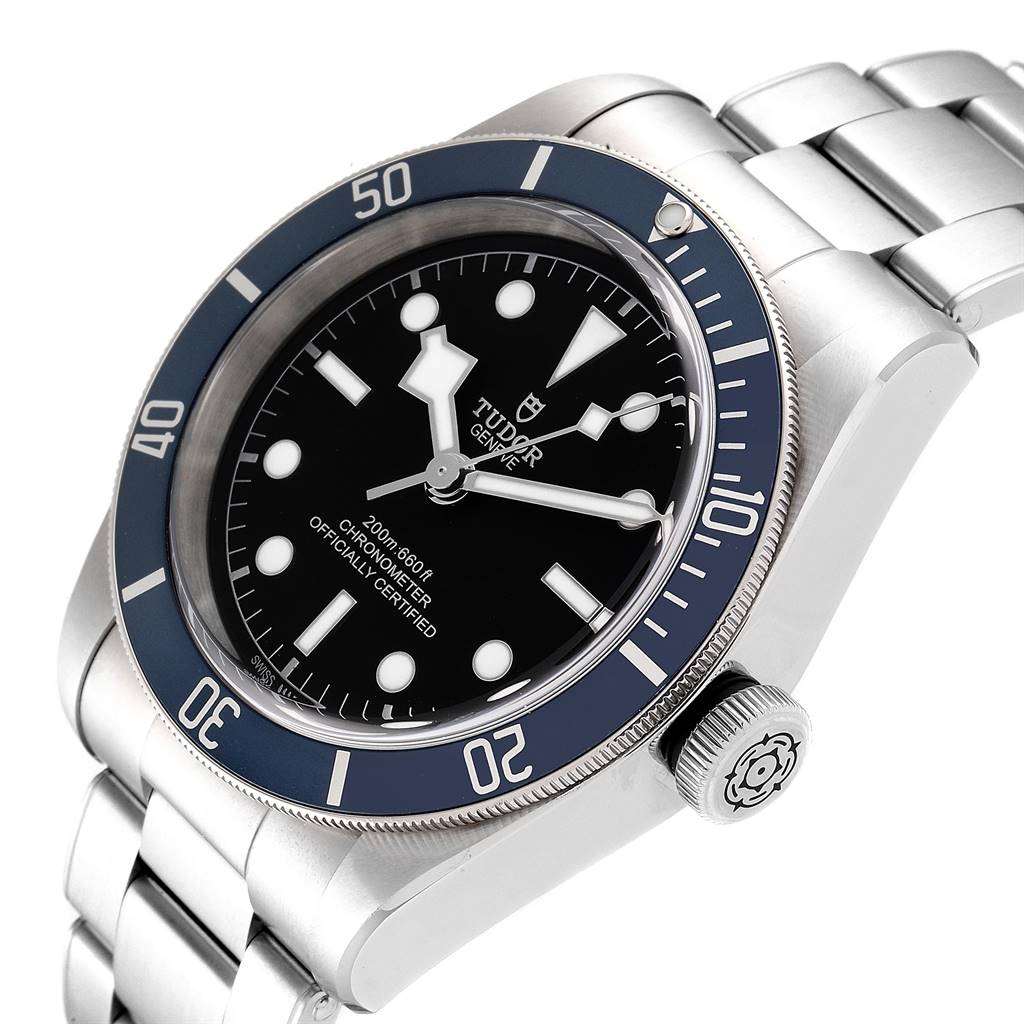 The image shows a close-up, angled view of the Tudor Heritage Black Bay 79230B Men's Stainless Steel Black Dial 79230B Men's Stainless Steel Black Dial watch, highlighting the dial, bezel, and part of the bracelet.