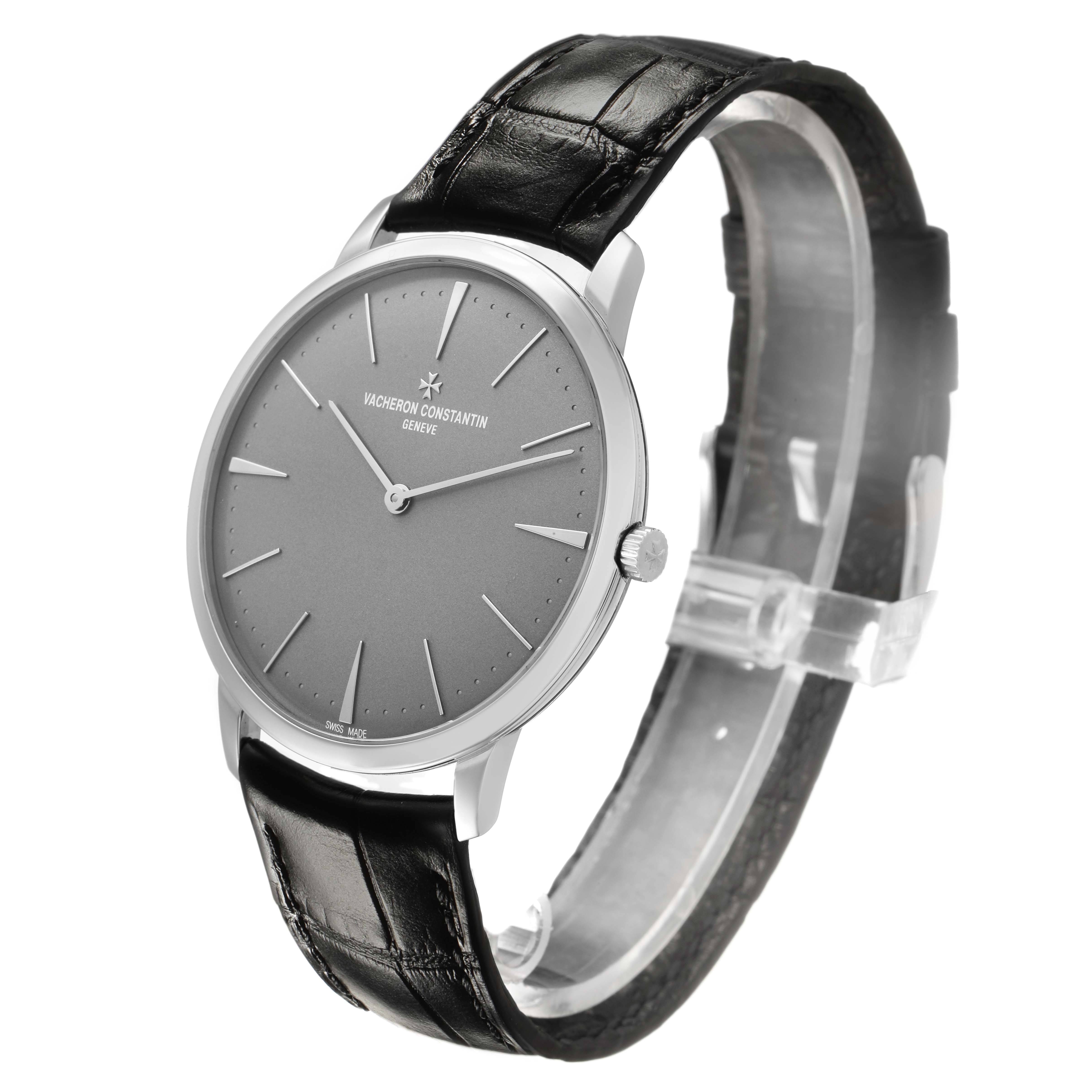 The Vacheron Constantin Patrimony 81180/000P-9539 Men's Platinum Grey Dial watch is shown at a three-quarter angle, displaying the dial, case, and leather strap.