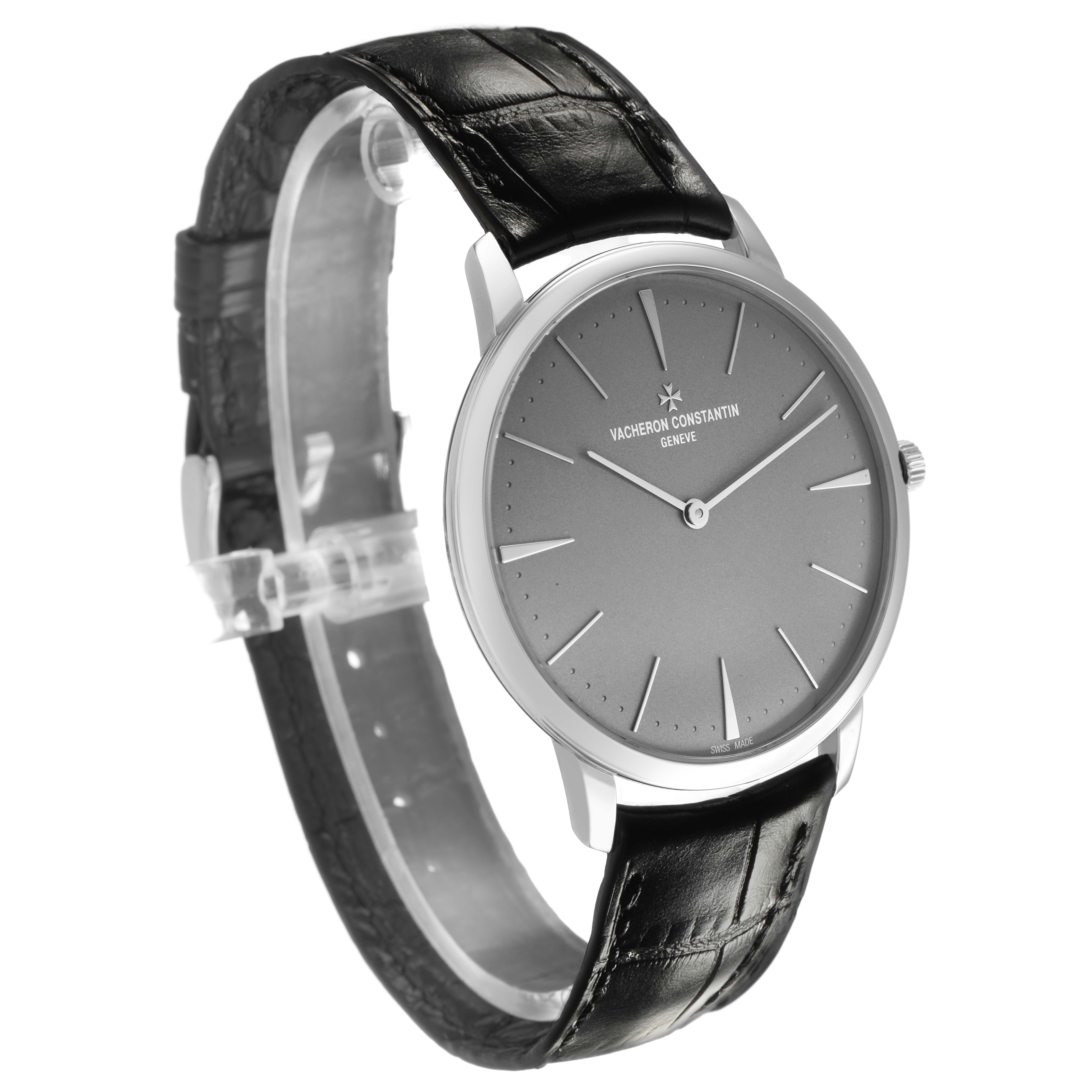 The Vacheron Constantin Patrimony 81180/000P-9539 Men's Platinum Grey Dial watch is shown at a three-quarter angle, displaying the face, case, and black leather strap.